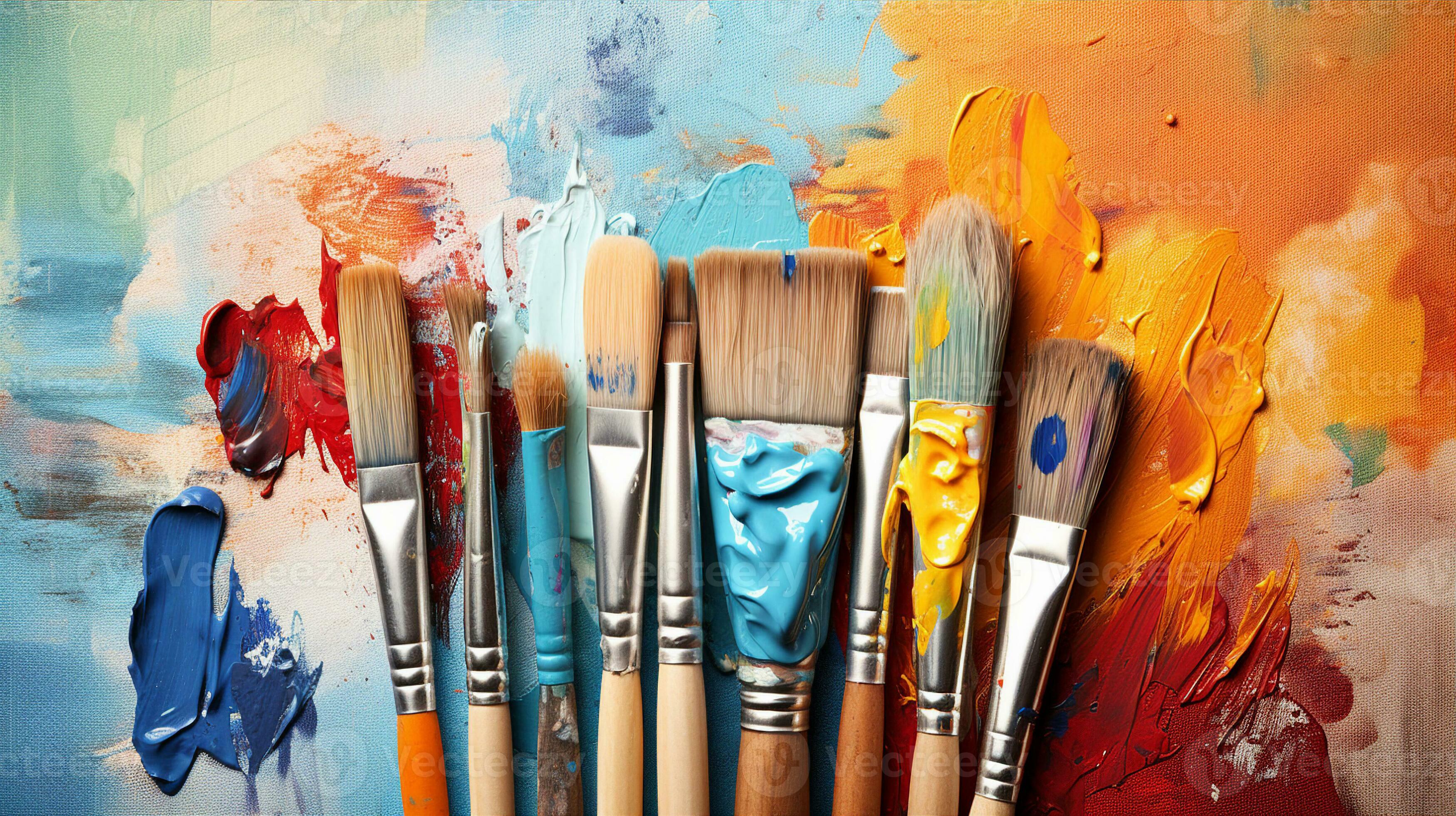 Displaying a set of artist brushes, paints, and a canvas, capturing the