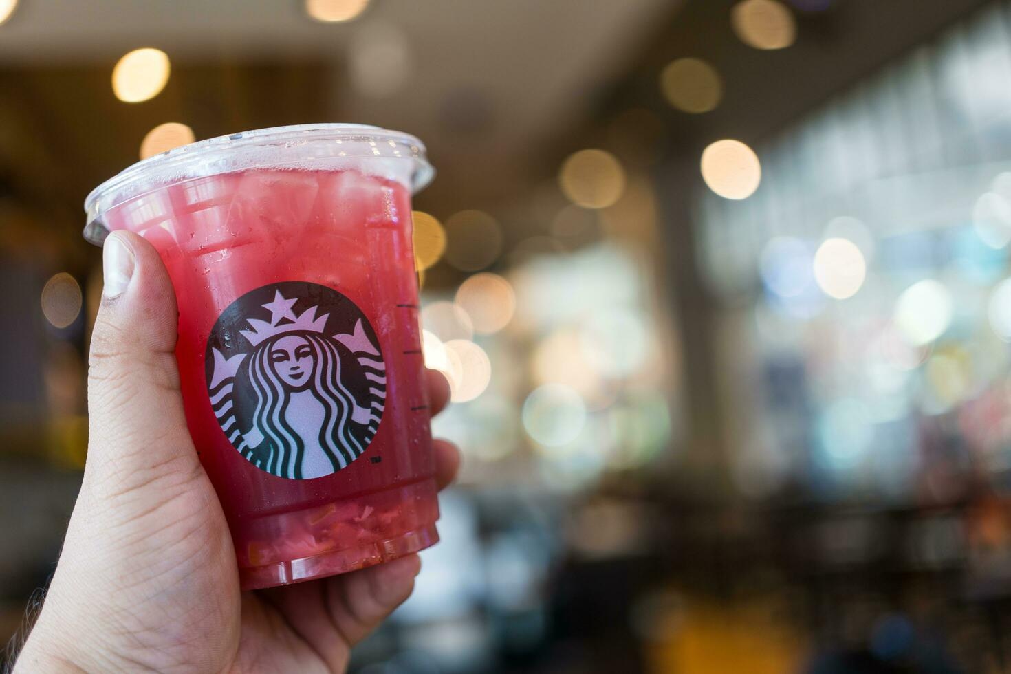 Bangkok, Thailand - August 22, 2023 Thailand Exclusive drink, Iced Shaken Lychee Rose with Hibiscus Lemon Tea photo