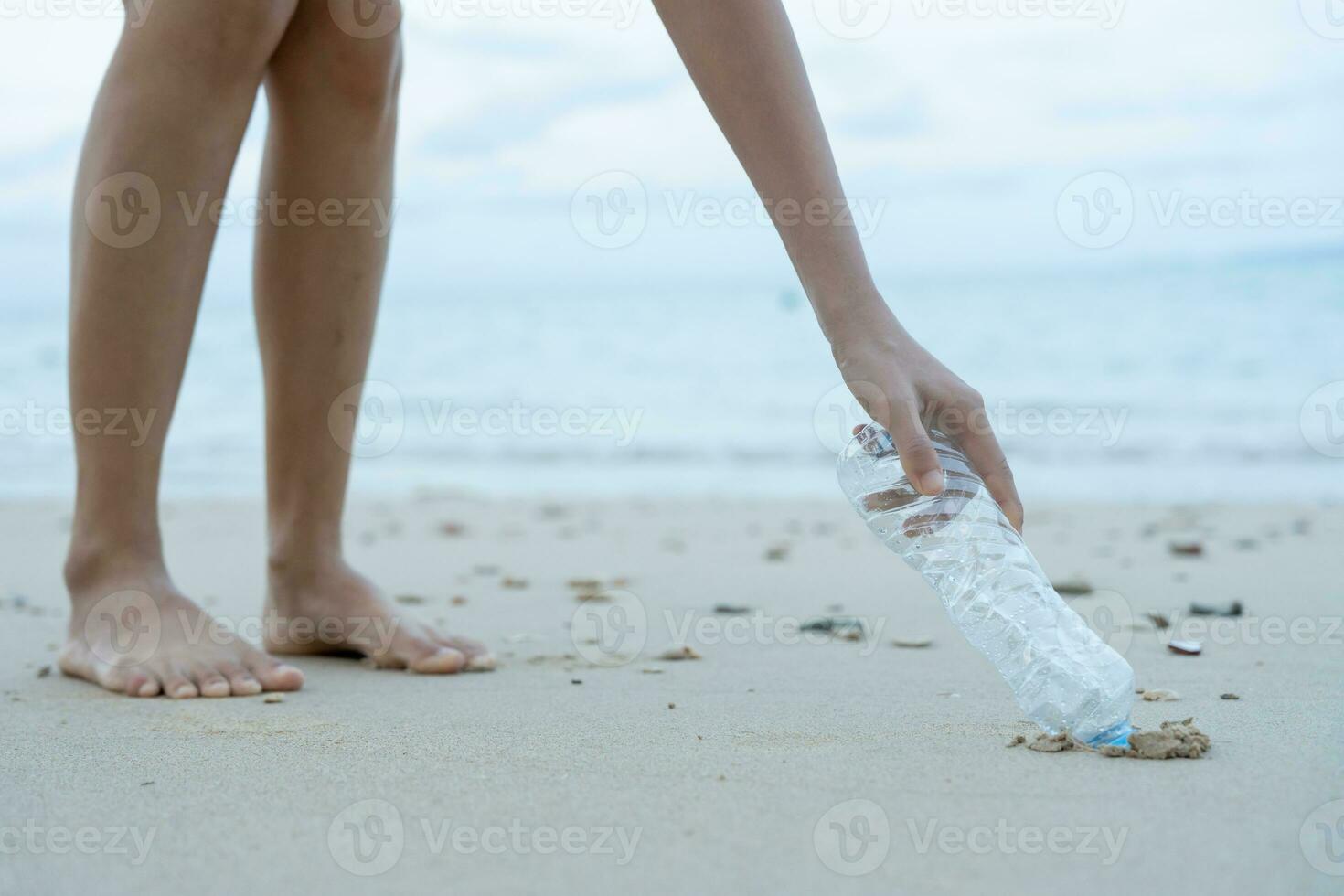 Save ocean. Volunteer pick up trash garbage at the beach and plastic bottles are difficult decompose prevent harm aquatic life. Earth, Environment, Greening planet, reduce global warming, Save world photo