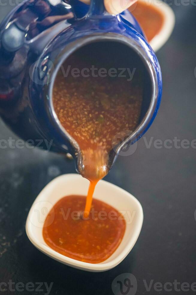 Sweet chili sauce or Thai Suki sauce with sesame photo