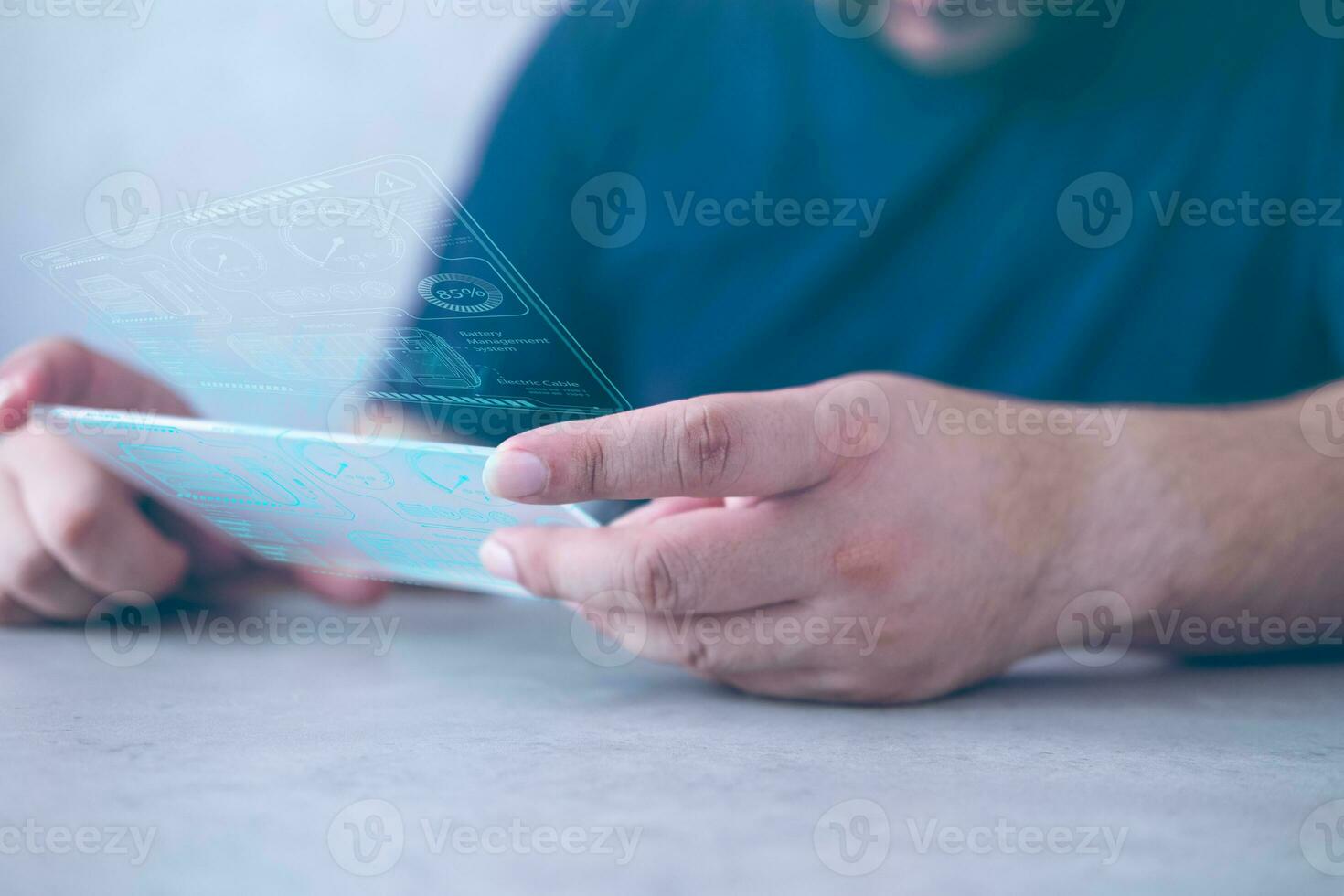 EV concept car in digital hologram dashboard display screen on a human hand. photo