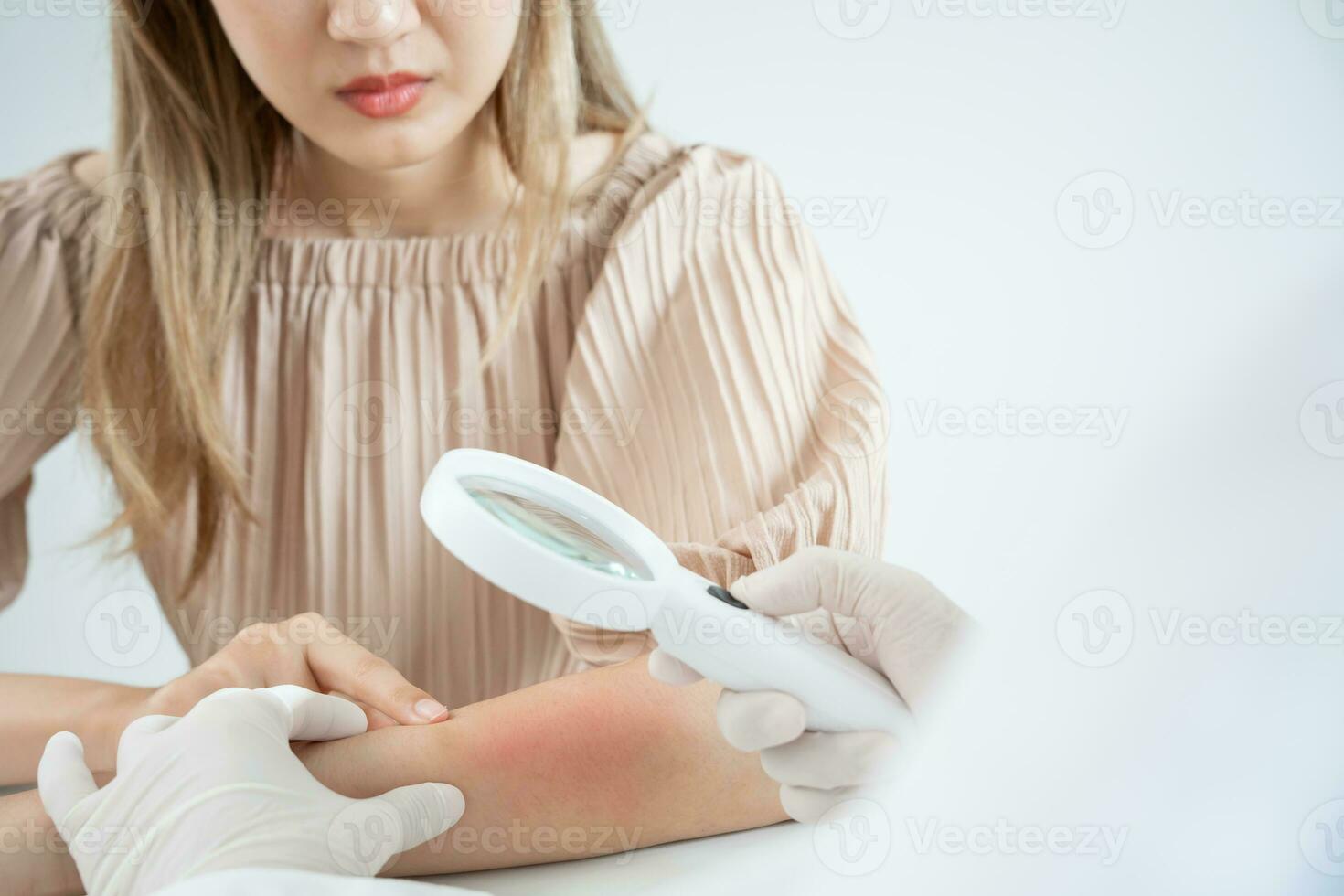 skin problem and beauty of asian girl. Dermatologist use magnifying glass look itchy skin from skin allergic, steroid allergy, sensitive skin, chemical allergy, rash, insect bites, Dermatitis. photo