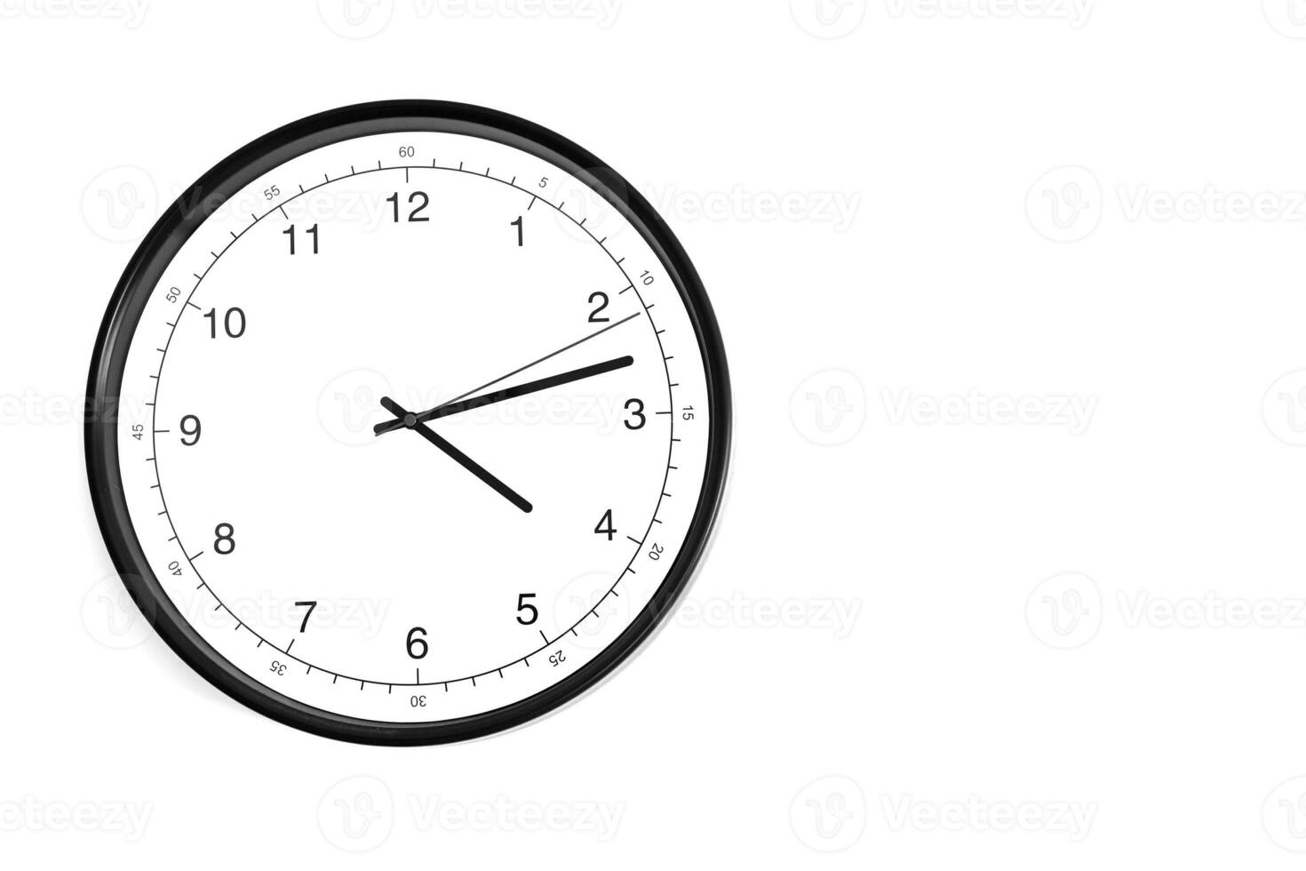 Part of analogue plain wall clock on white wall background. Four o'clock twelve minutes. Close up with copy space, timing, time management, opening hours time, school concept and lunch time. photo