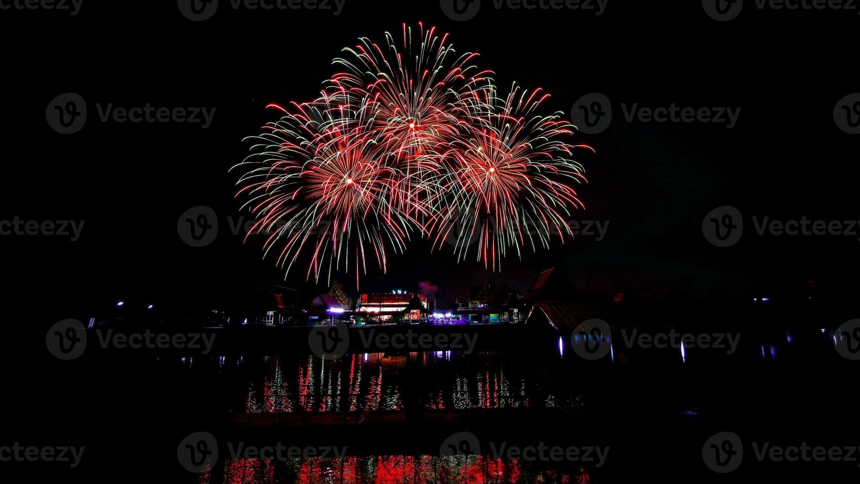 fireworks over the temple in the dark sky photo