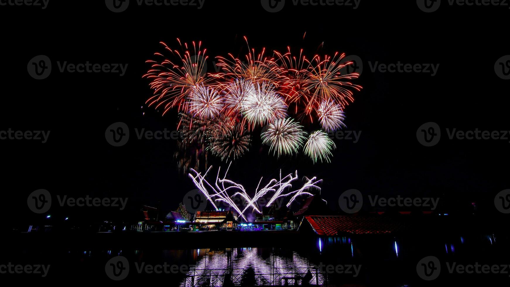 fireworks over the temple in the dark sky photo