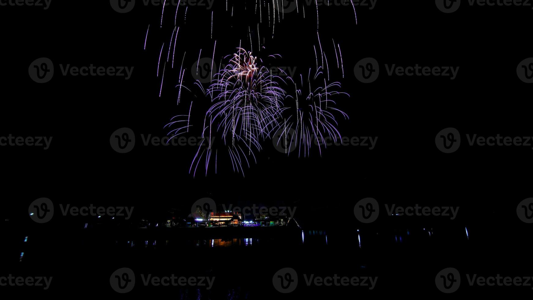 fireworks over the temple in the dark sky photo