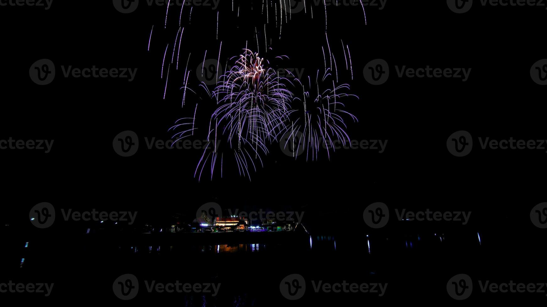 fireworks over the temple in the dark sky photo