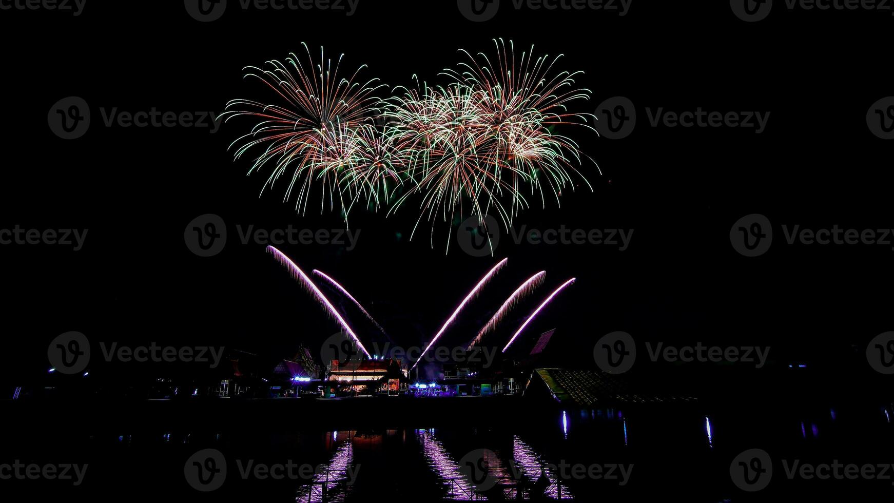 fireworks over the temple in the dark sky photo