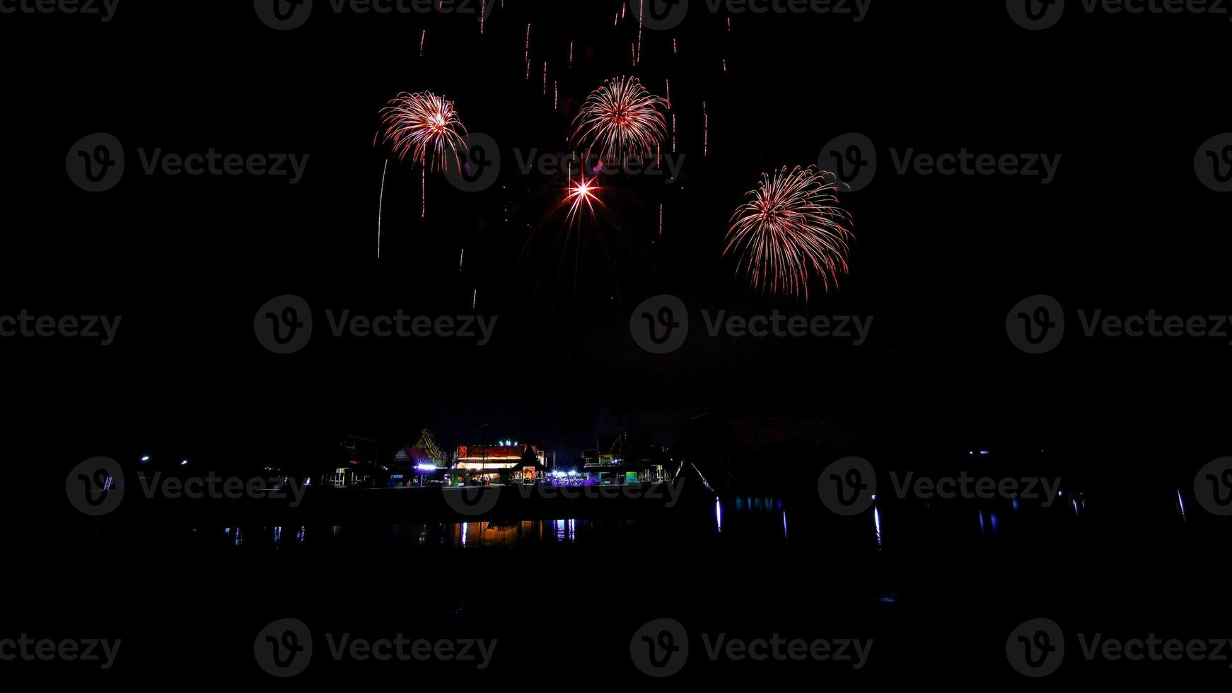 fireworks over the temple in the dark sky photo