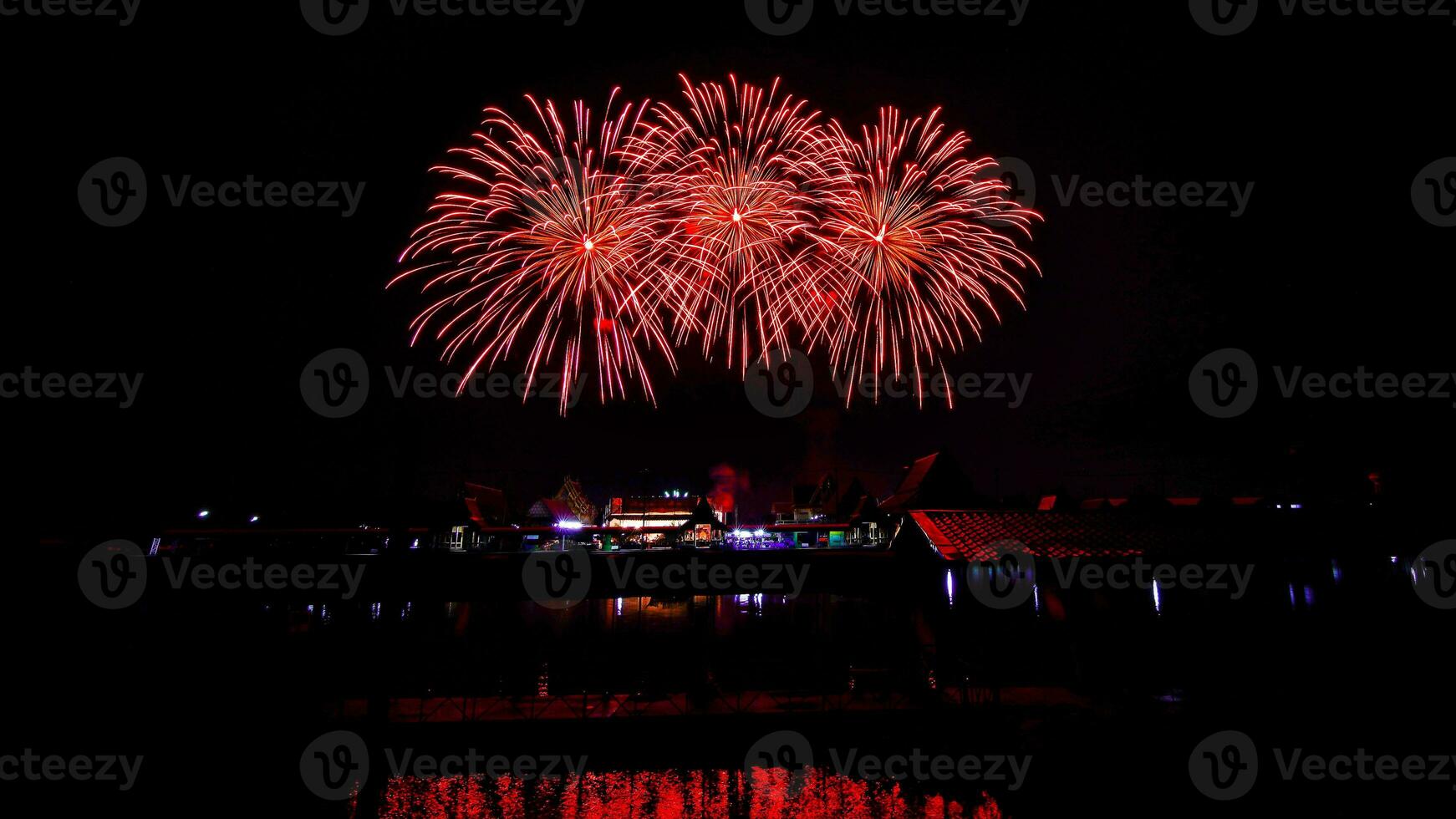 fireworks over the temple in the dark sky photo