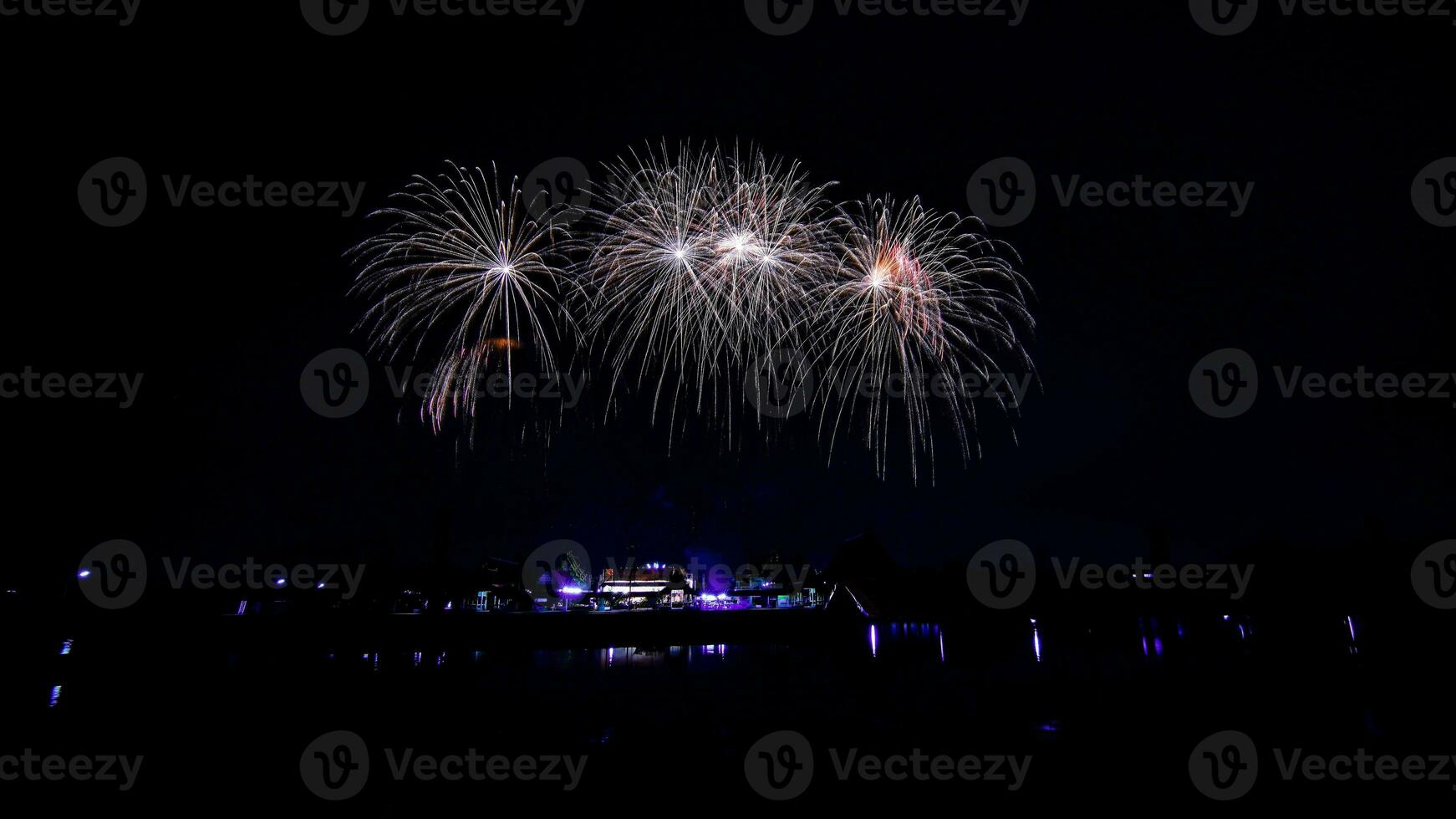 fireworks over the temple in the dark sky photo