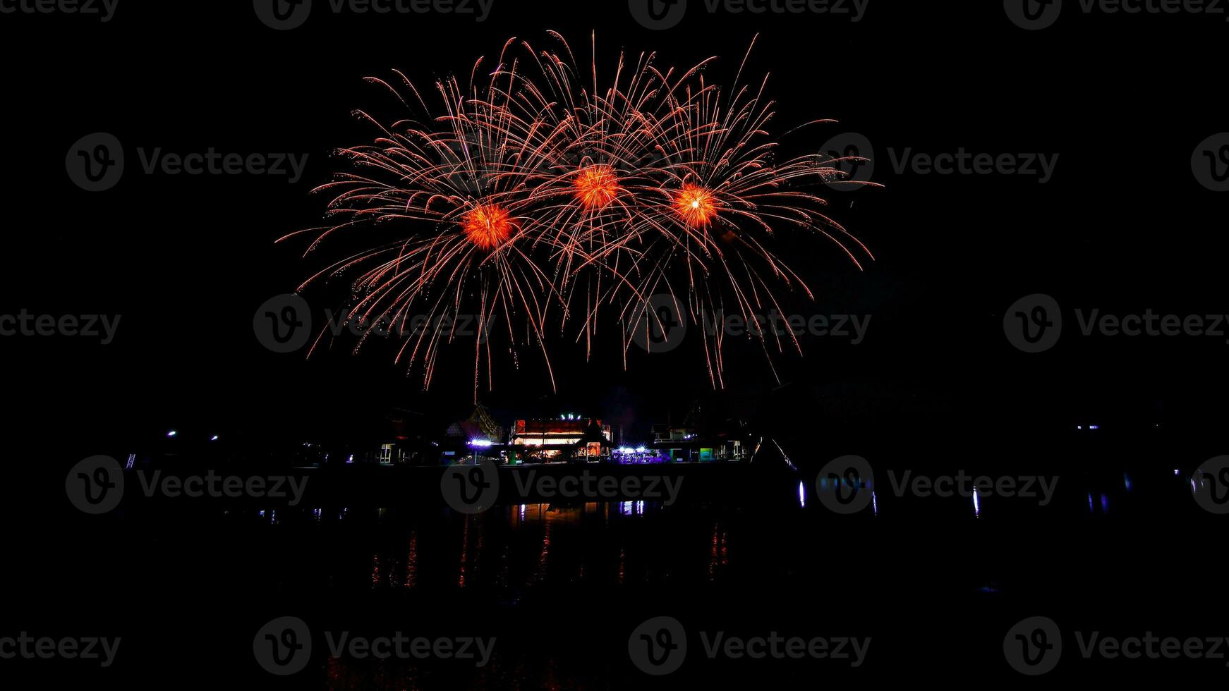 fireworks over the temple in the dark sky photo