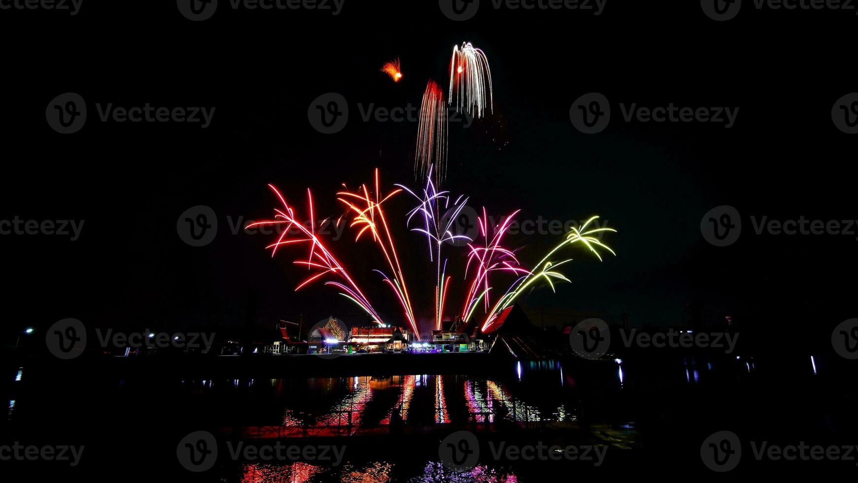 fireworks over the temple in the dark sky photo