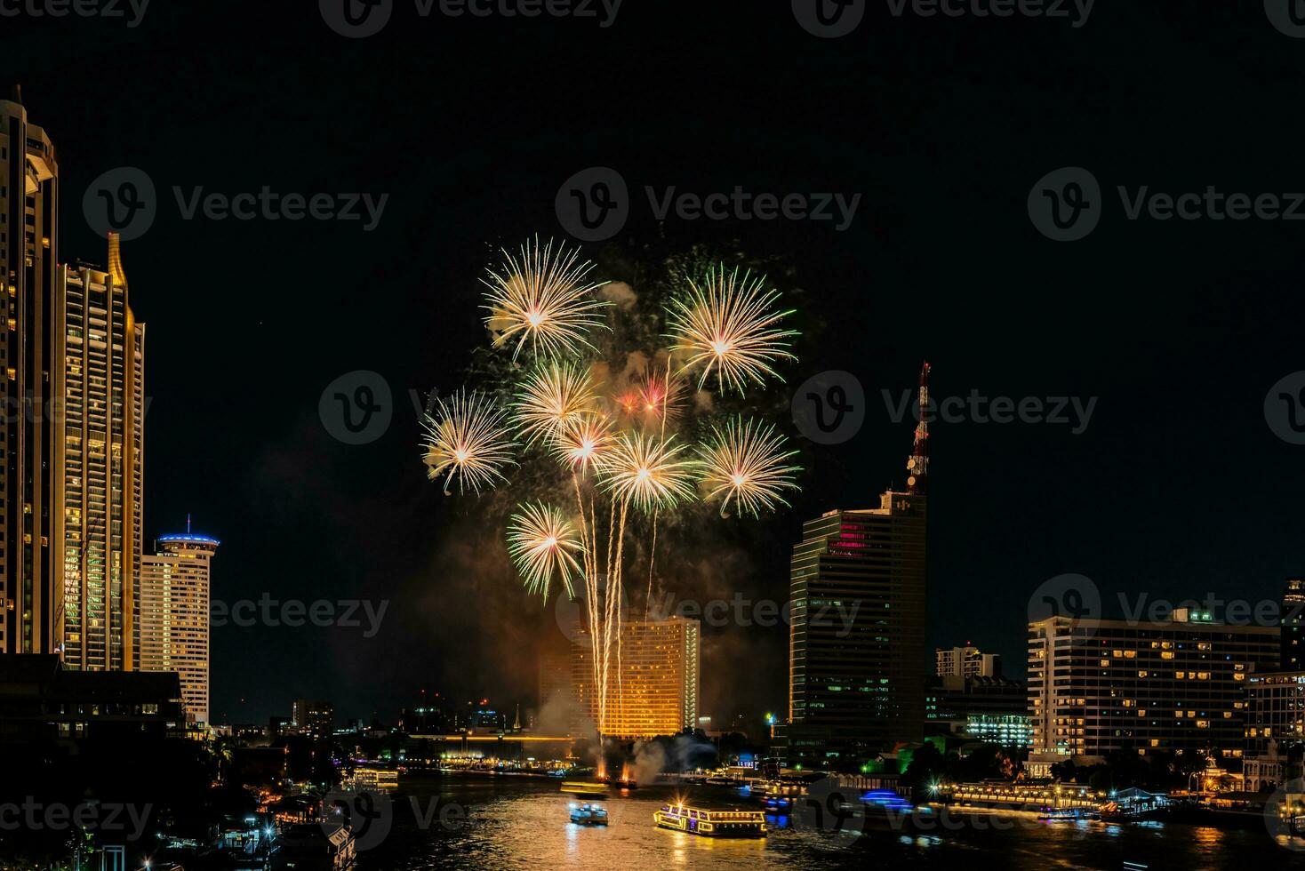 fireworks on the river in the dark sky photo