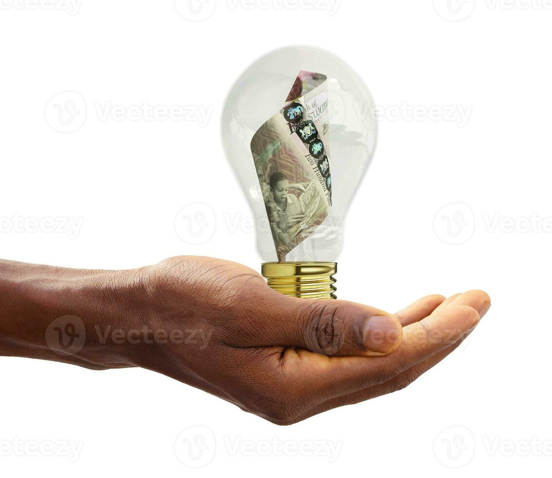 Black Hand holding 3d rendered new Botswanan Pula note inside transparent light bulb, creative thinking. Making money by solving problem. Having idea concept photo