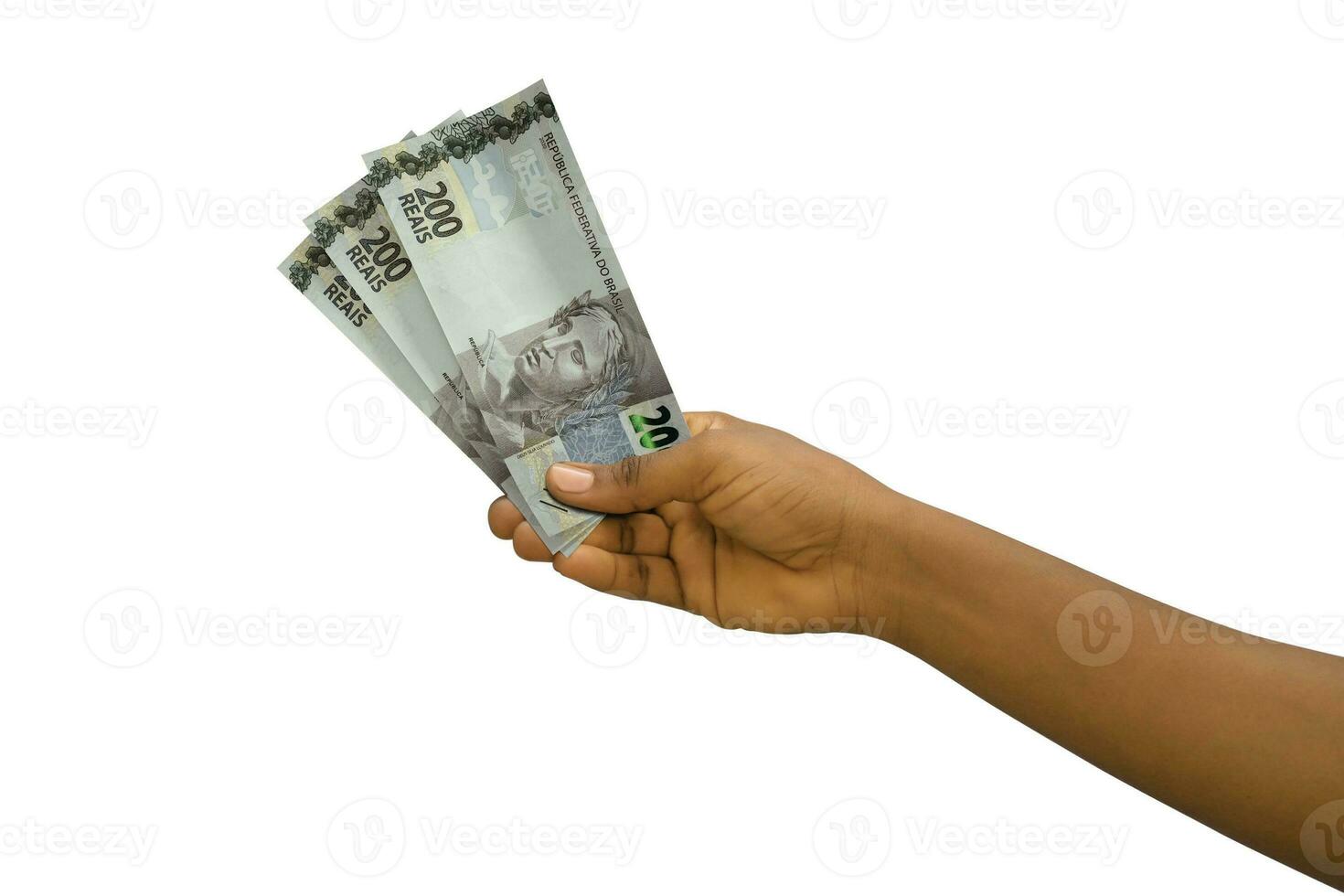 Fair hand holding 3D rendered Brazilian real notes isolated on white background photo