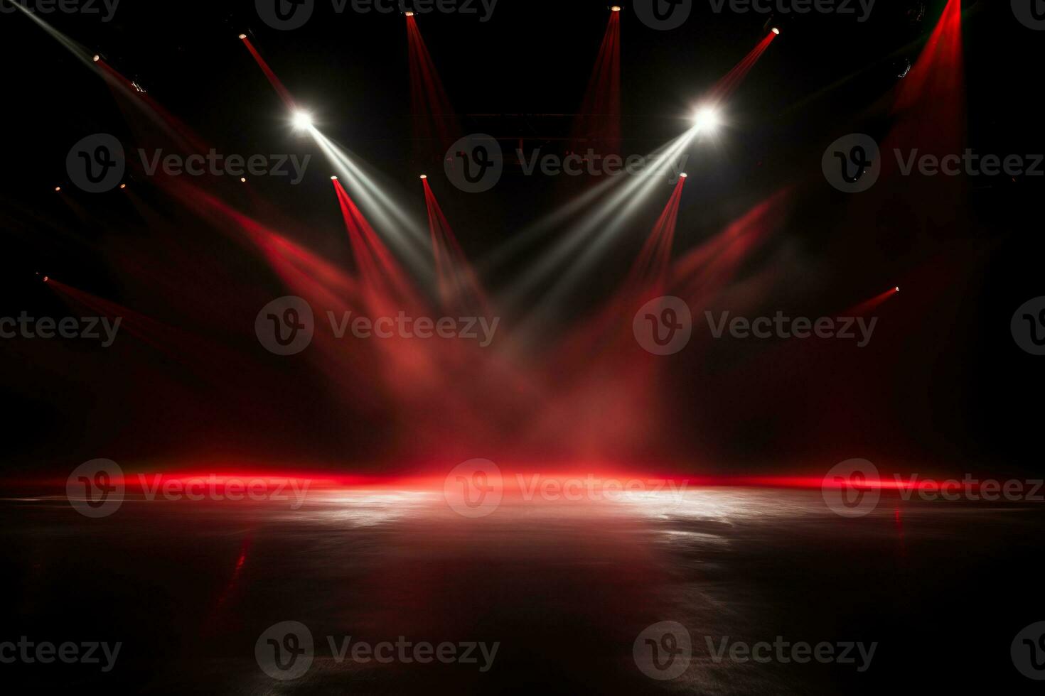 An empty room illuminated by red and white spotlights. Concrete floor, stage photo