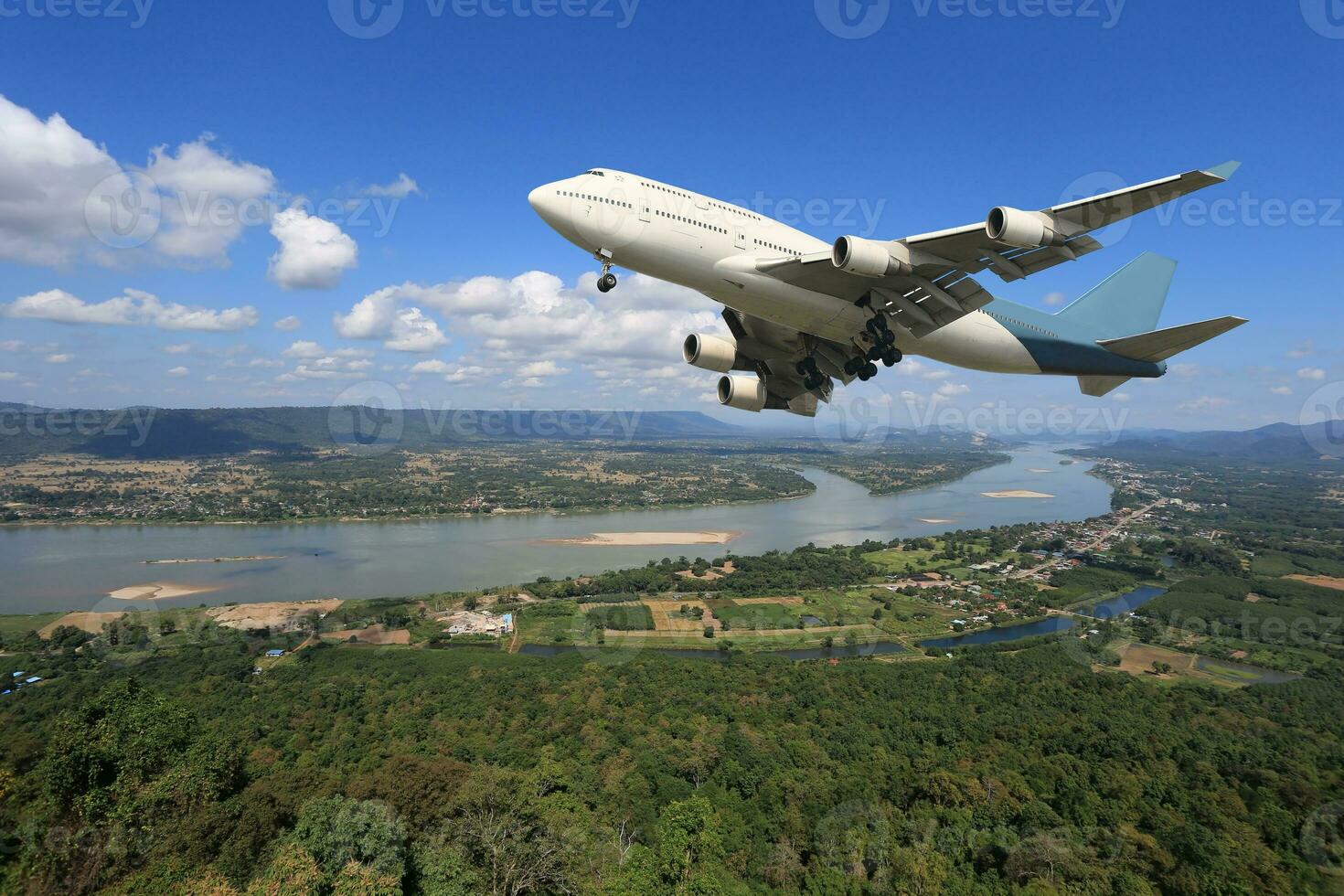 Airplane is flying above the clouds on beautiful sky background,Holidays and business concept photo