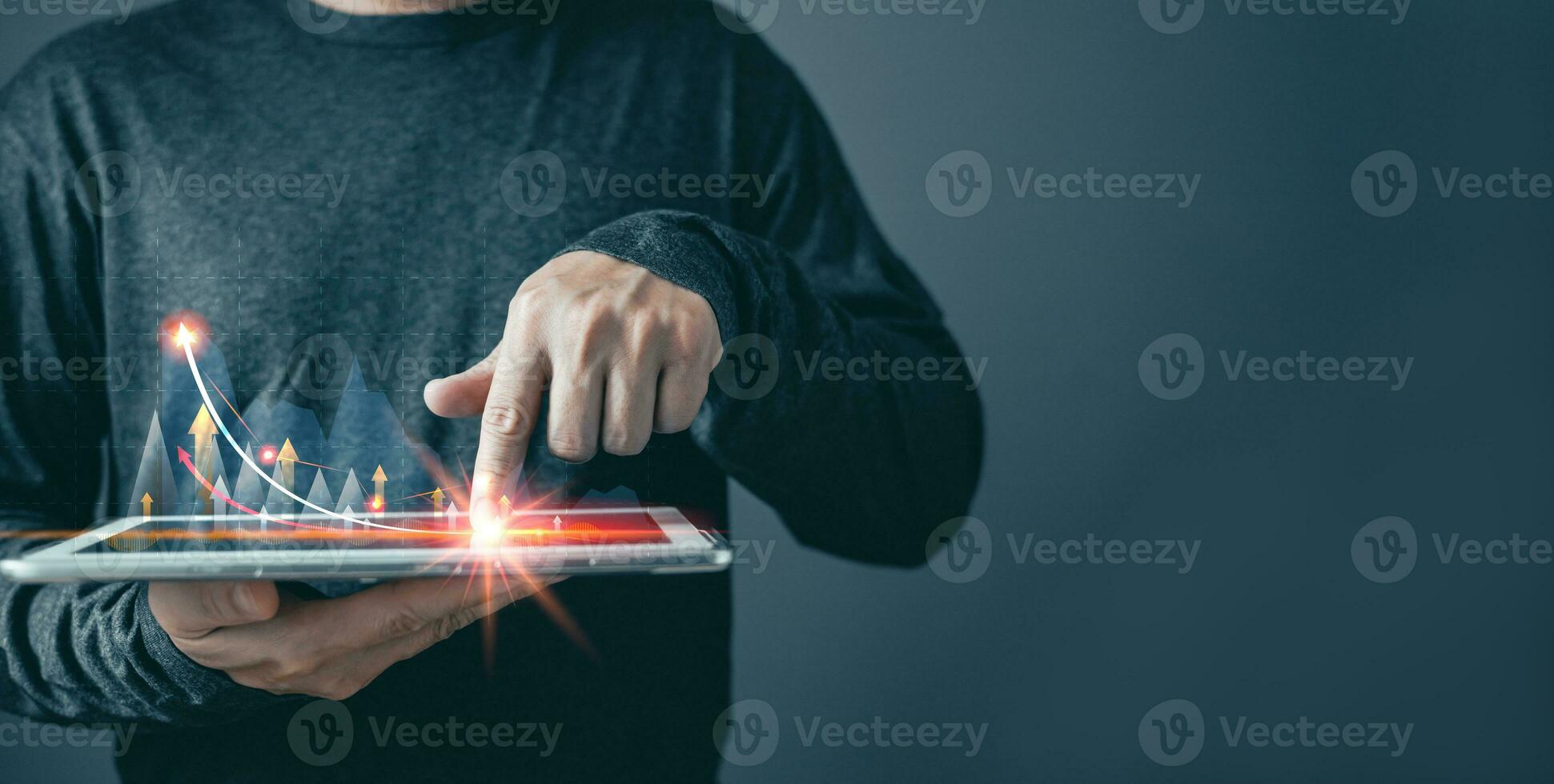 man draw growth graphs and progress of business and analyze financial, and investment.Use technology to plan strategy to success goals and growth stock.online business, e-commerce, online marketing. photo