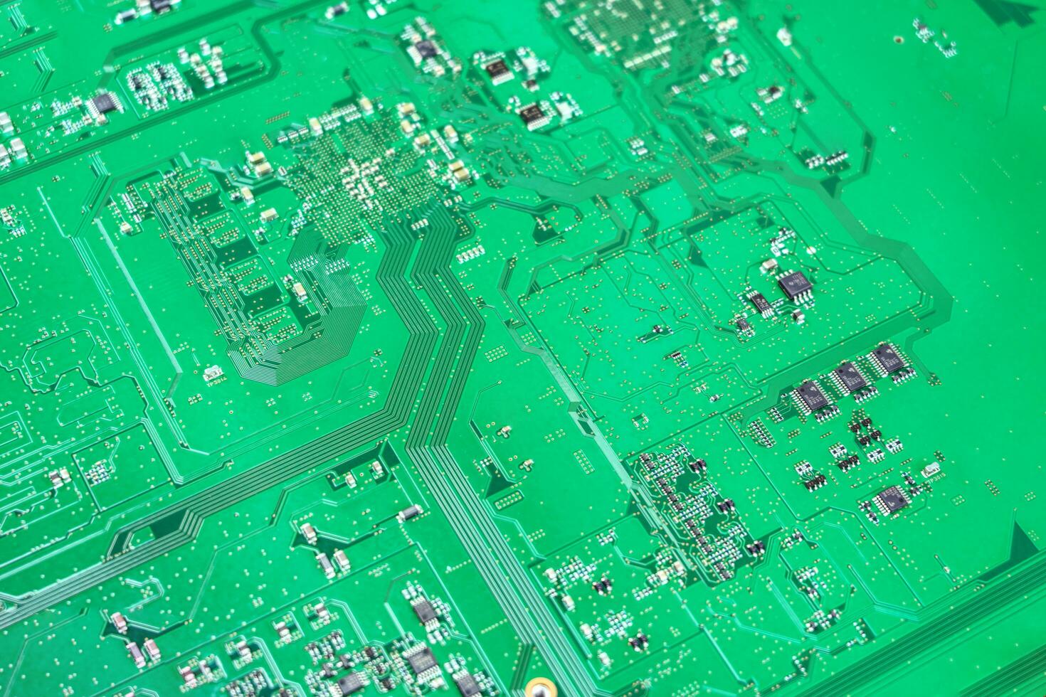 Green electronic circuit board texture background photo