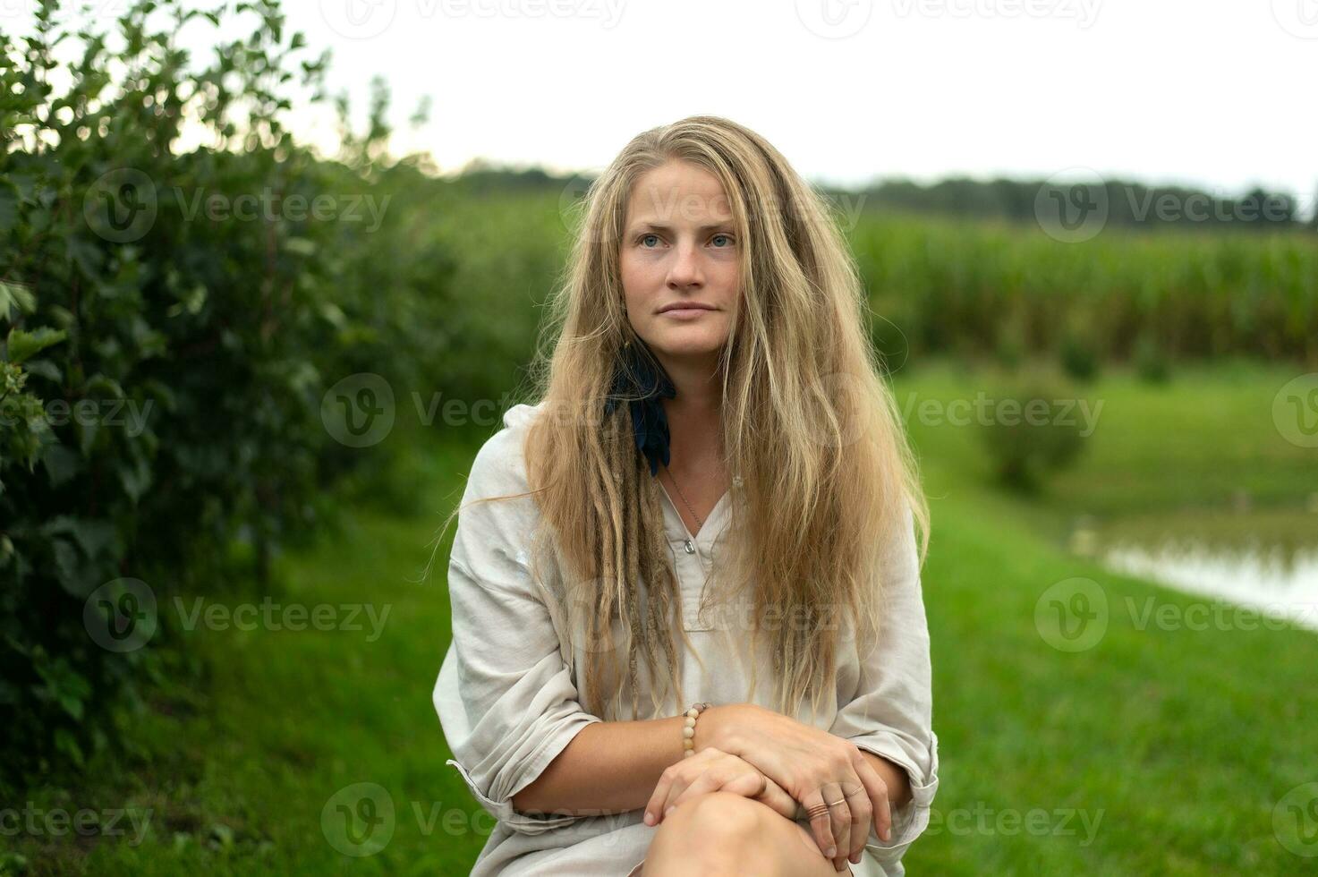 Young natural beautiful female on green nature background photo