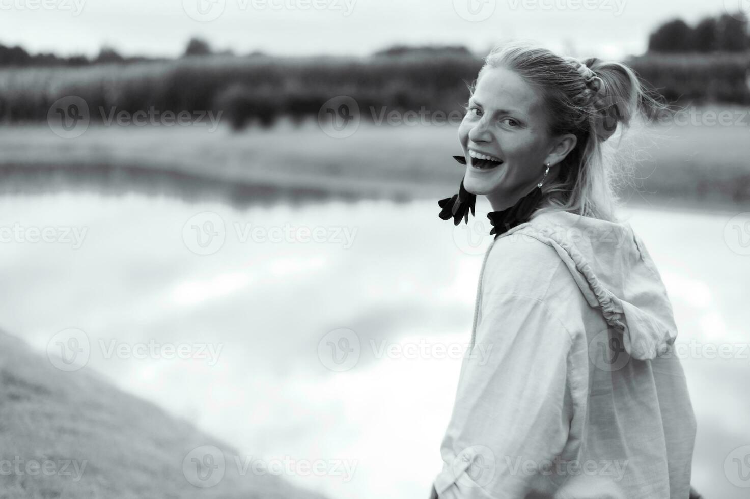 Young natural beautiful female on green nature background photo