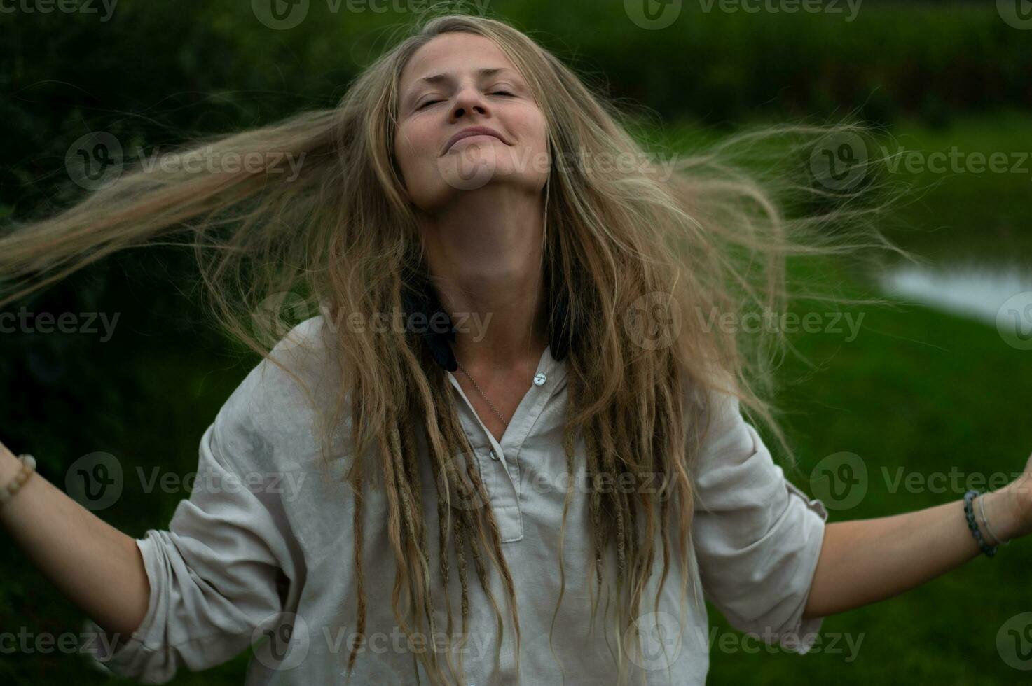 Young natural beautiful female on green nature background photo