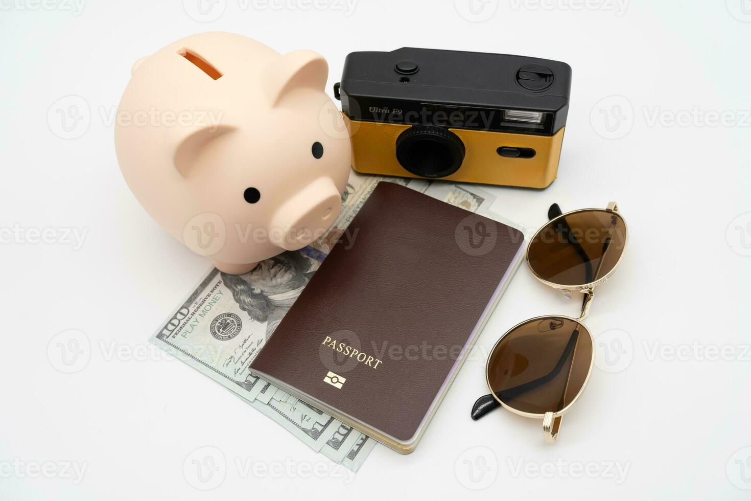 Travel planning and budget concept. Film Camera, Passport, Calculator, piggy bank and collecting money for vacation trip. Preparing for vacation. photo