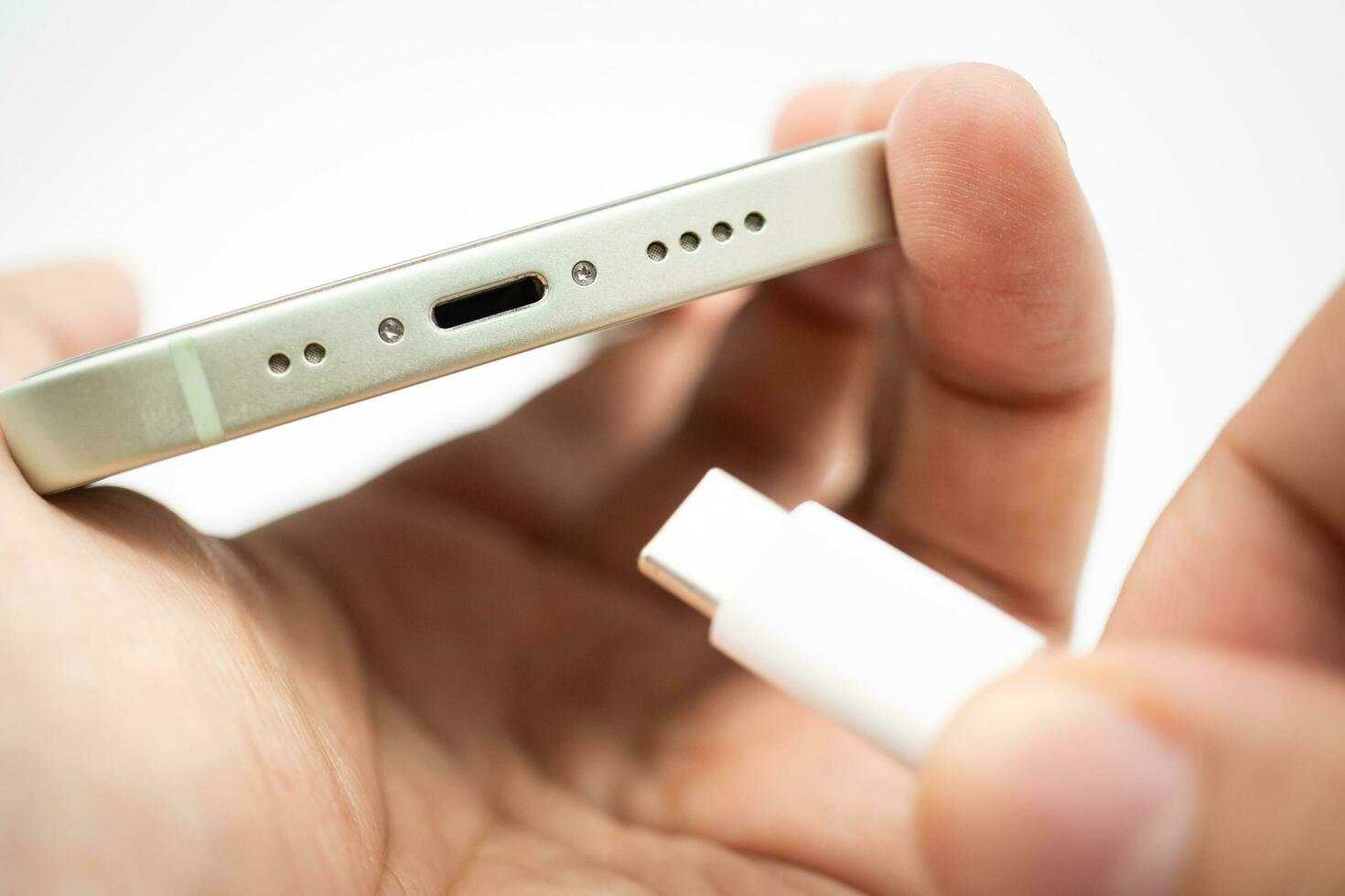 Bangkok Thailand SEP 25 2023 phone with Usb-c Cable Charger. Phone Transition to USB-C. New Phone Model with Standardized Cable. photo