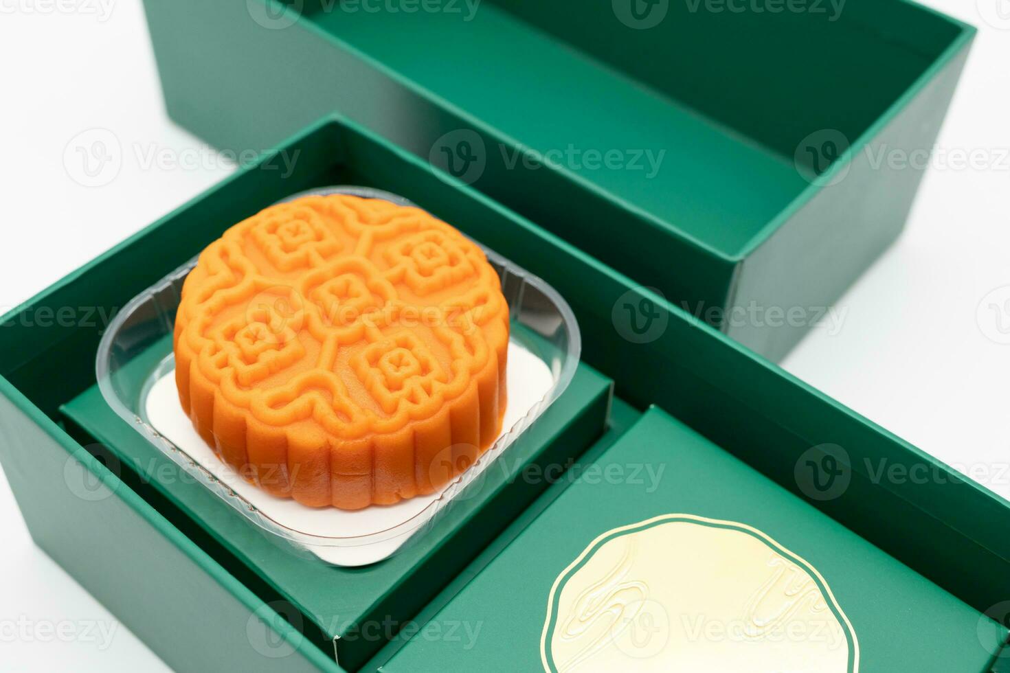 moon cake in green box. Moon cakes gift box for the Chinese Mid-autumn festival isolated on white background. photo