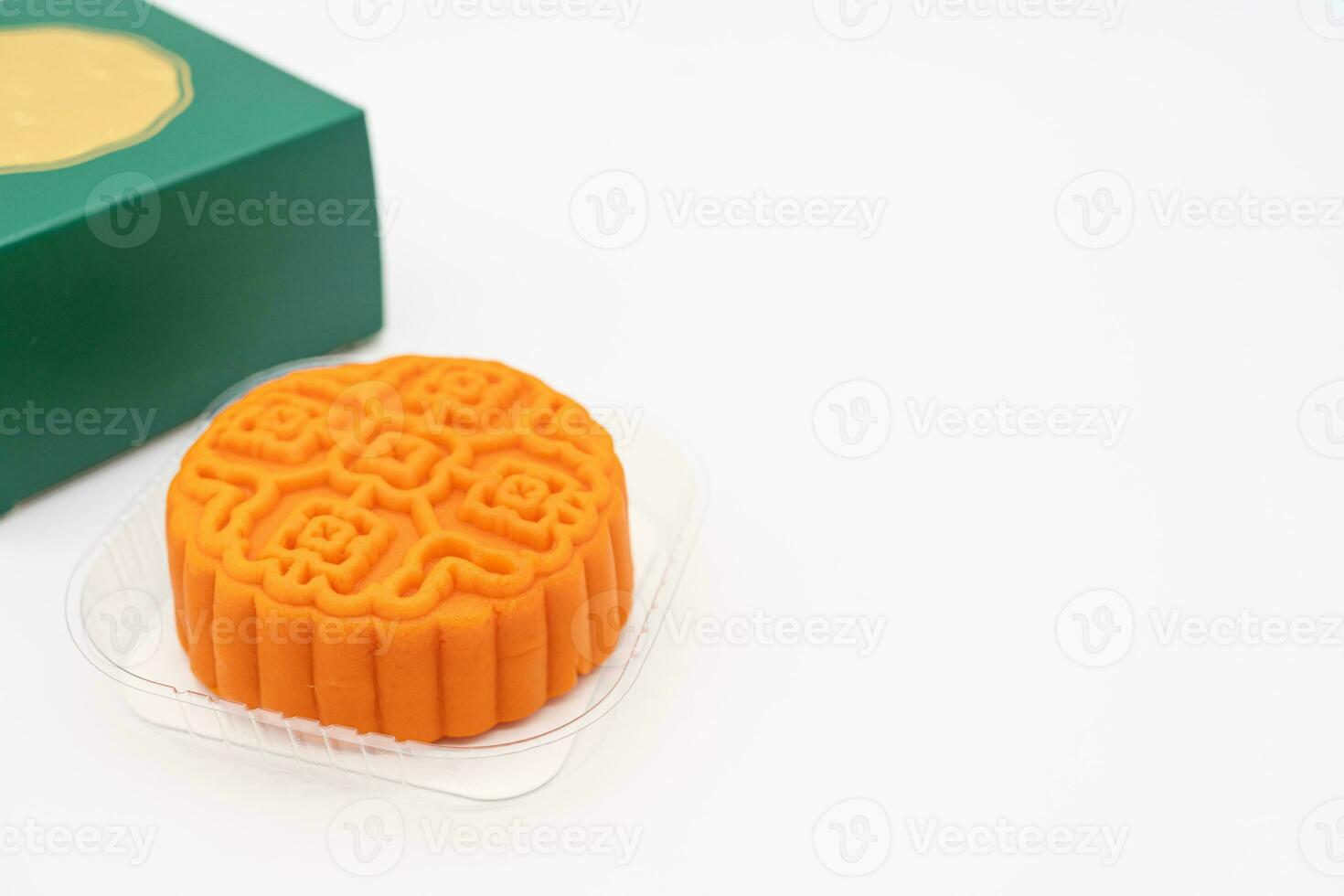 Moon cake with green box. Moon cakes gift box for the Chinese Mid-autumn festival on isolated background. photo