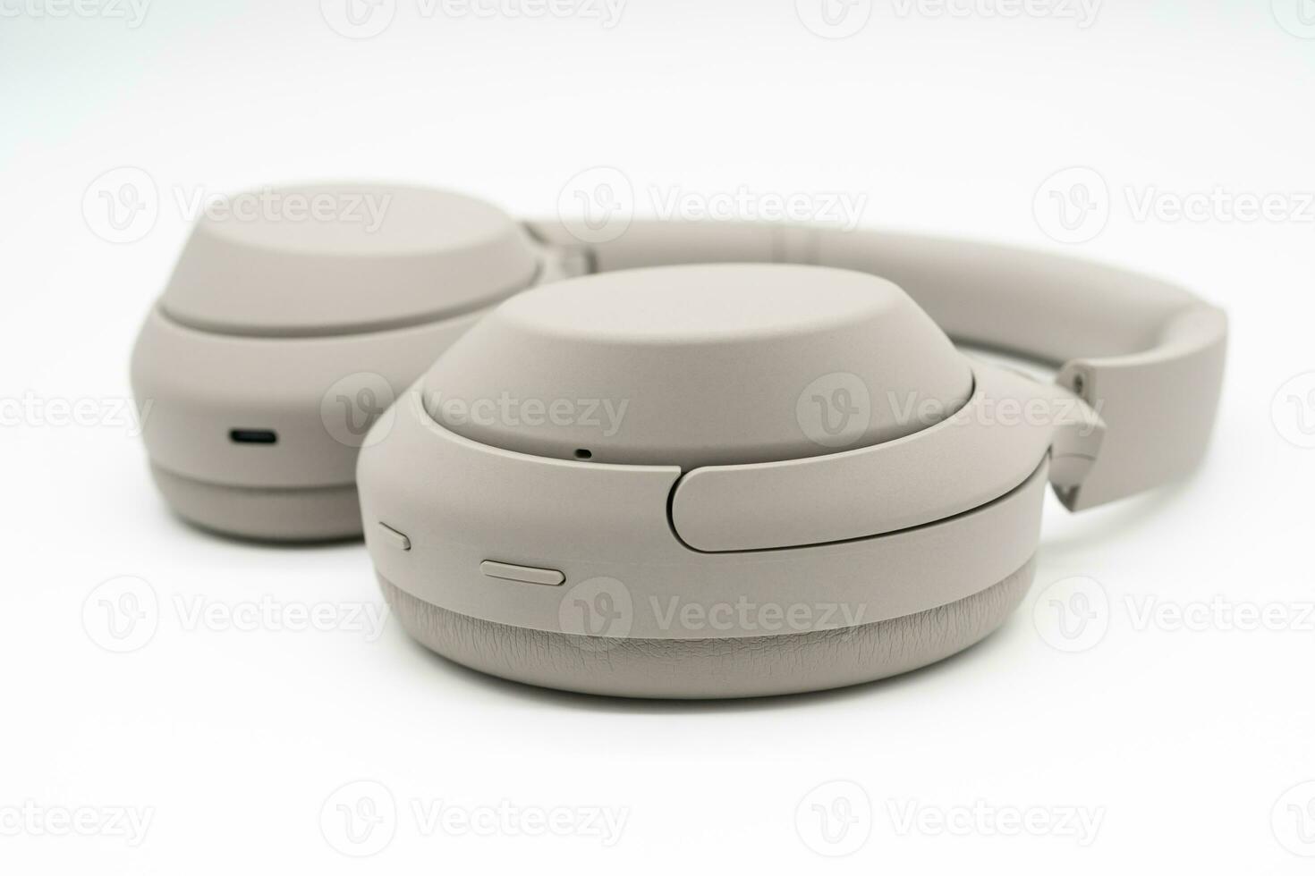 Wireless Silver headphones background on isolated background. With Noise Cancelling and Integrated Microphone. photo