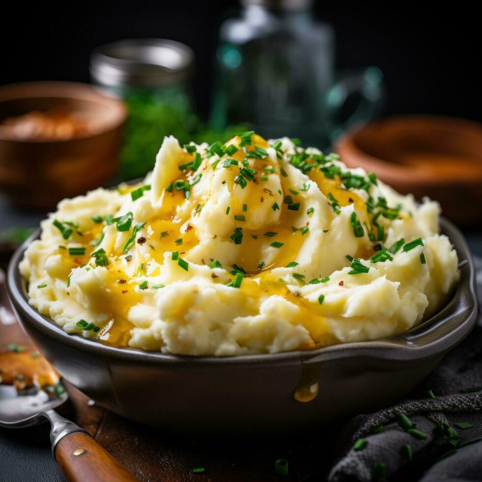 Creamy mashed potatoes with melted butter and chives photo