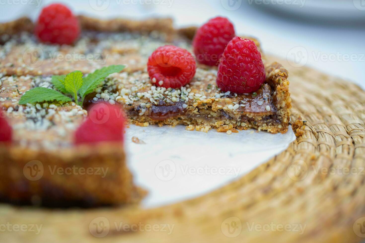 a piece of pie with raspberries on it photo