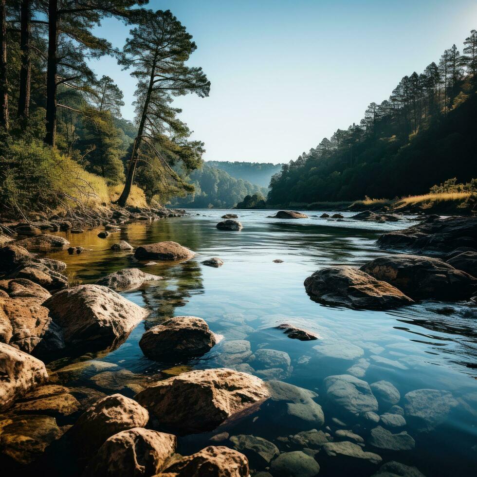 Blurred river with rocks and trees in foreground photo