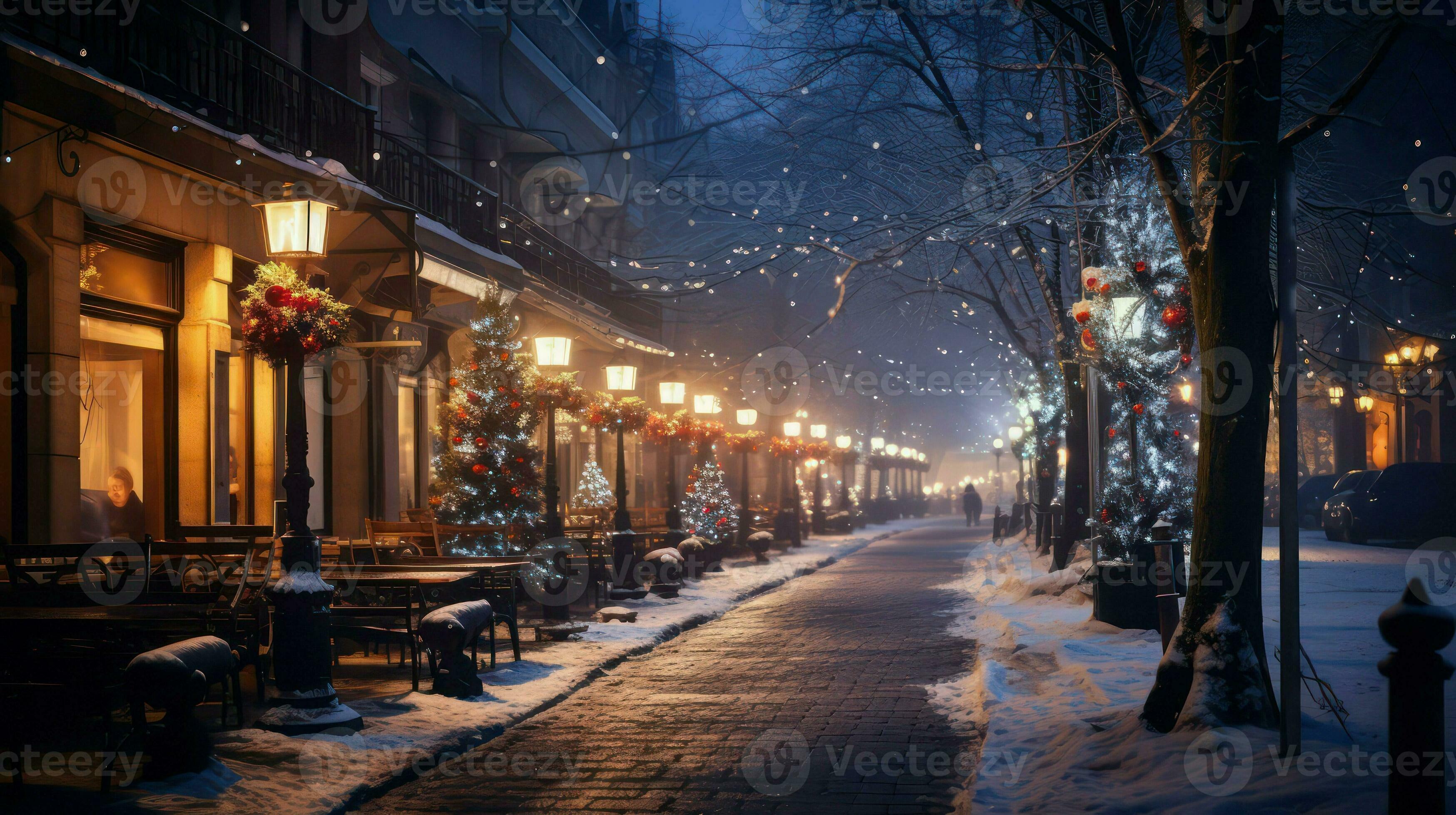 Winter city street at night with street lamps and trees covered