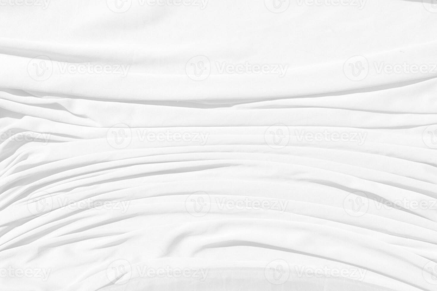 Top view Abstract White cloth background with soft waves.Wave and curve overlapping with different shadow of color,white fabric, crumpled fabric. photo