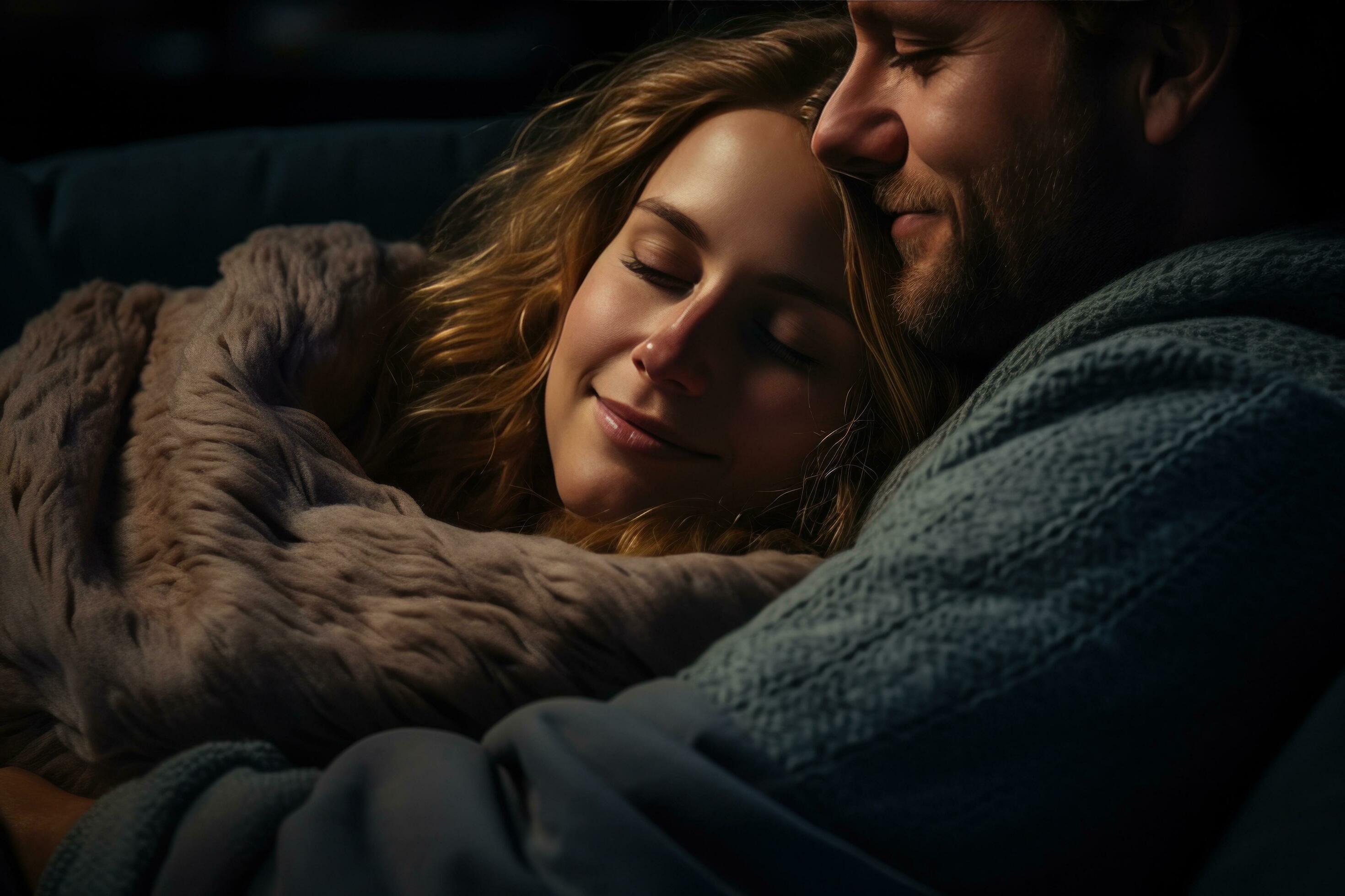 Woman cuddles with man while watching a movie. 30312999 Stock Photo at