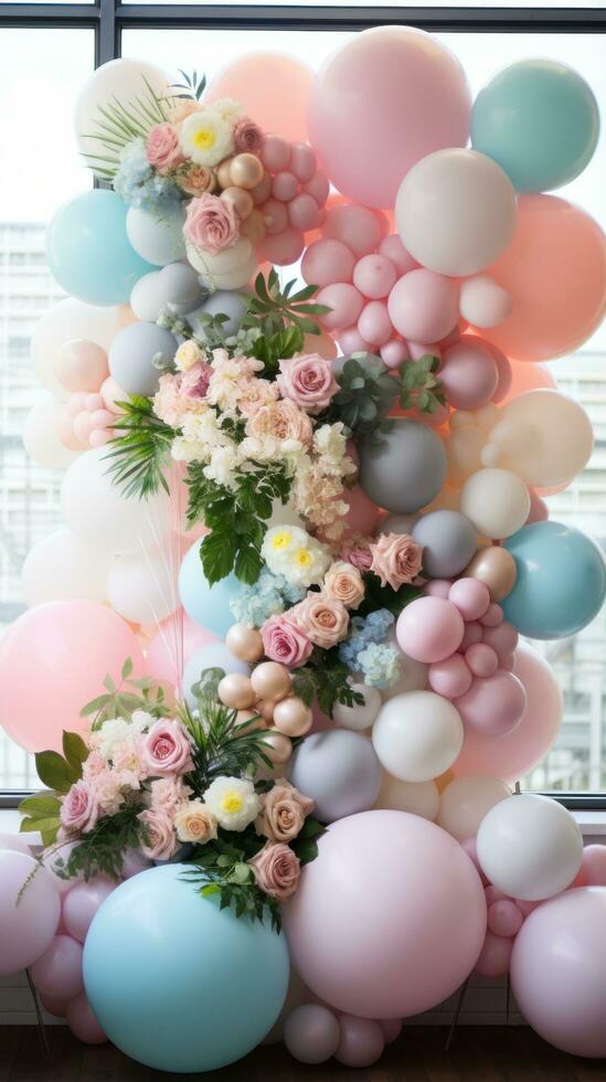 Pastel balloon garland with flowers and greenery photo