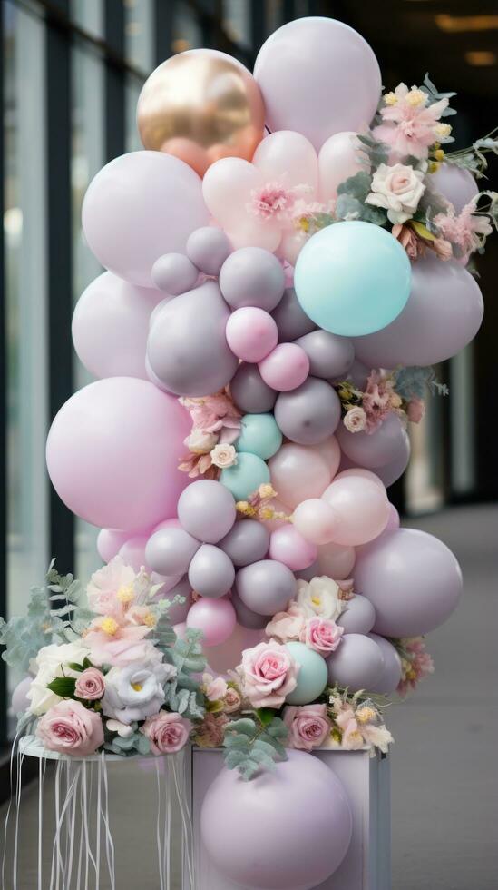 Pastel balloon garland with flowers and greenery photo
