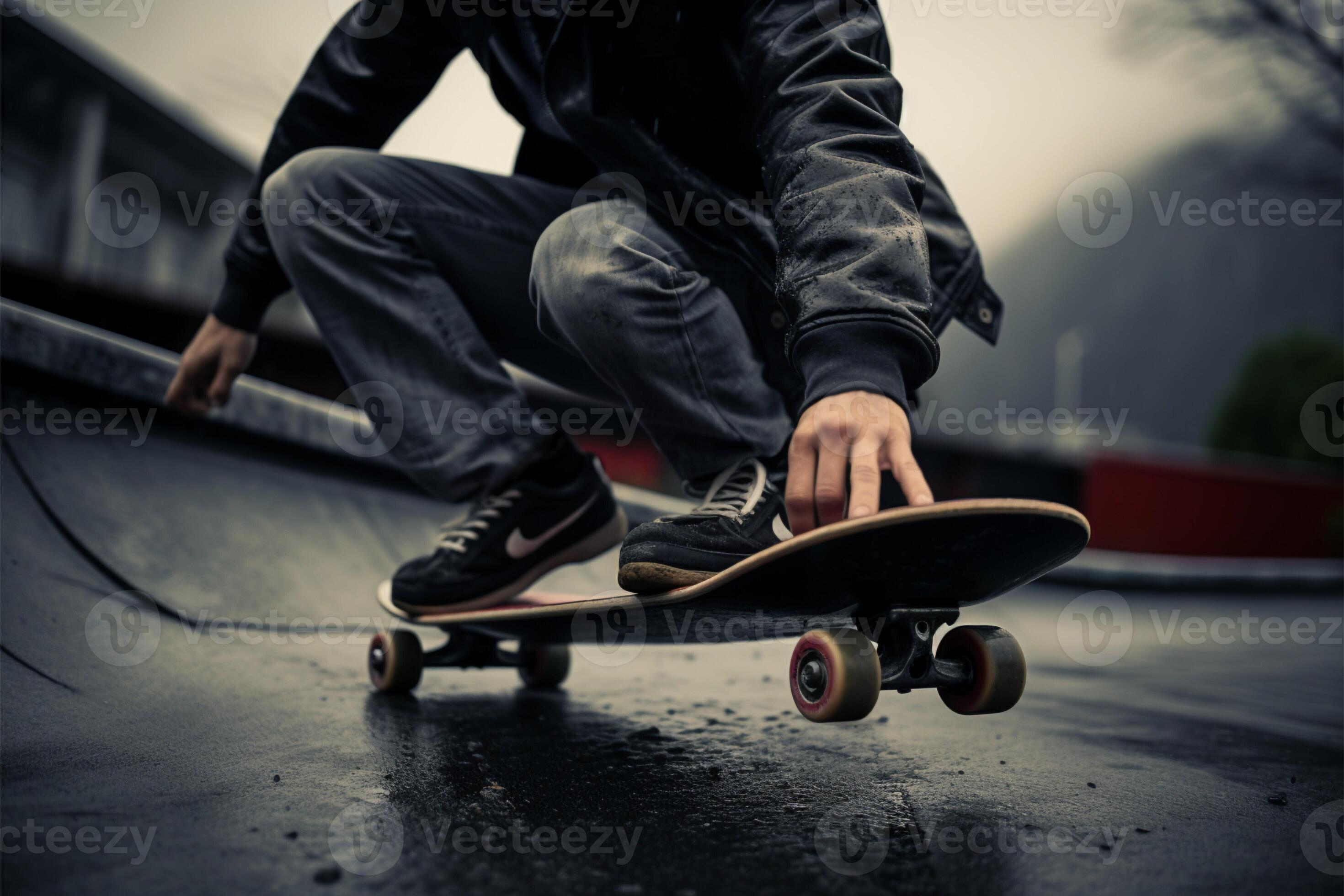Skateboarder stands on a grayscale deck capturing urban skating
