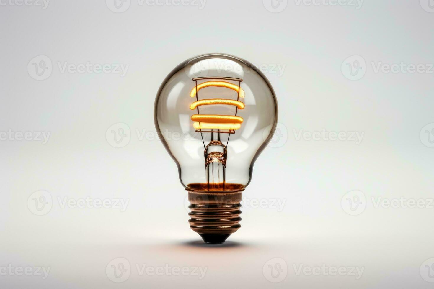 a glowing yellow light bulb photo