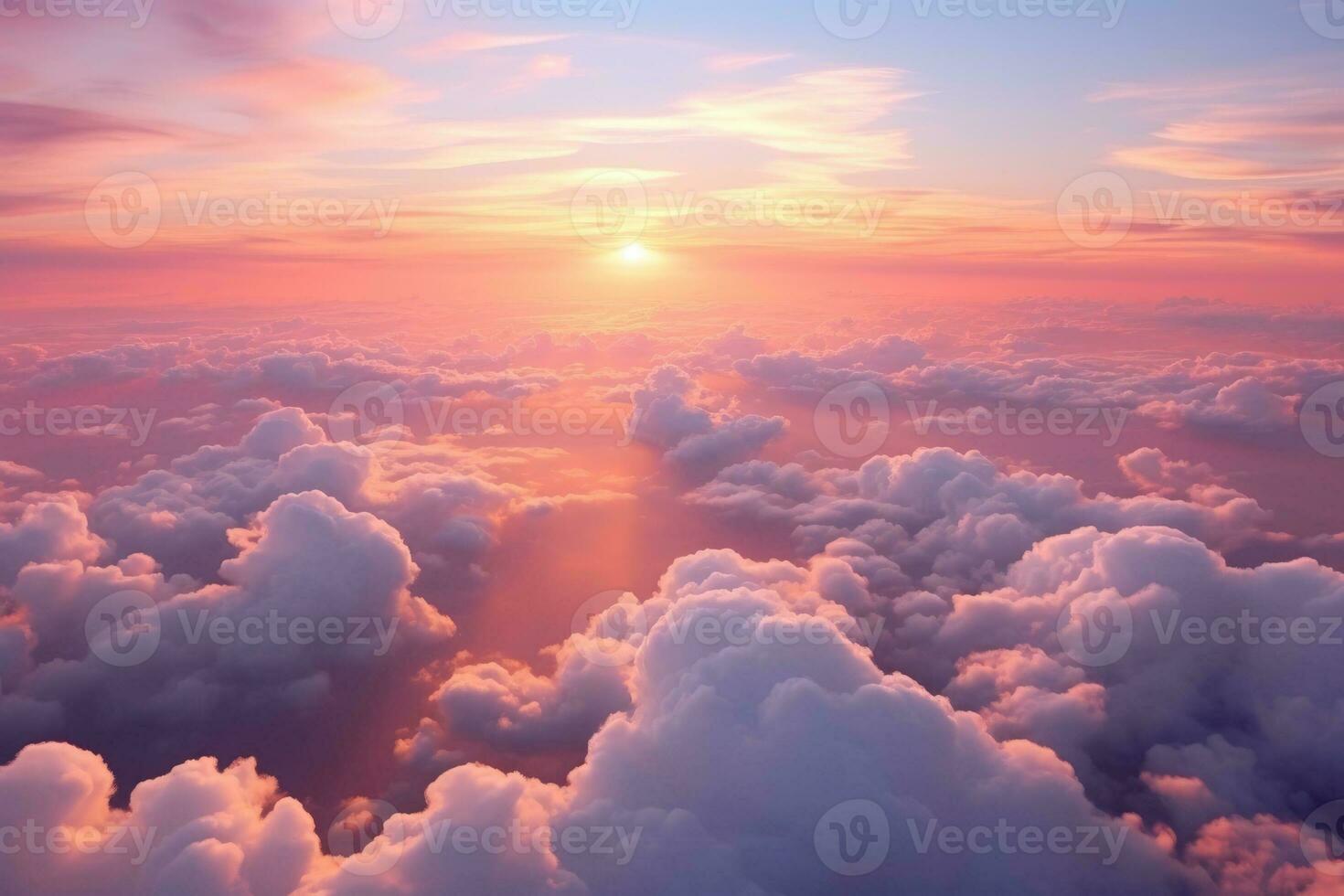 A breathtaking sunset over the clouds in the sky photo