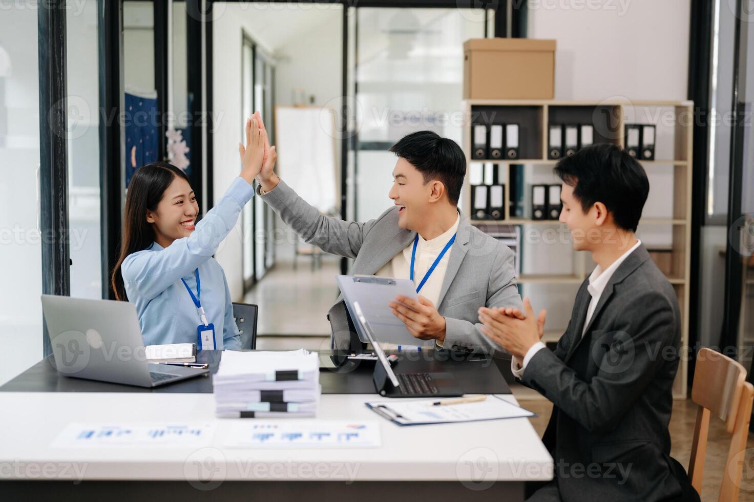 Business team discuss at meeting room. working together with laptop ,tablet and smart phone on desk Financial accountant , planner , meeting , introduction concept. At office photo
