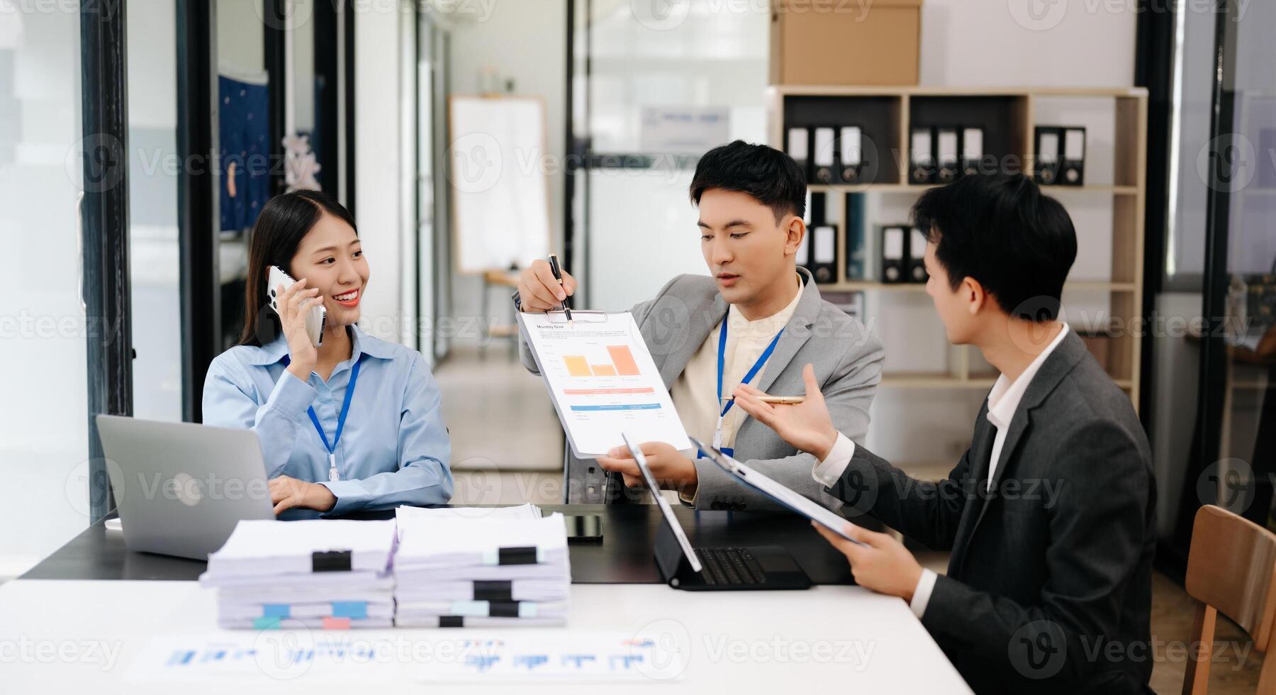 Business team discuss at meeting room. working together with laptop ,tablet and smart phone on desk Financial accountant , planner , meeting , introduction concept. At office photo