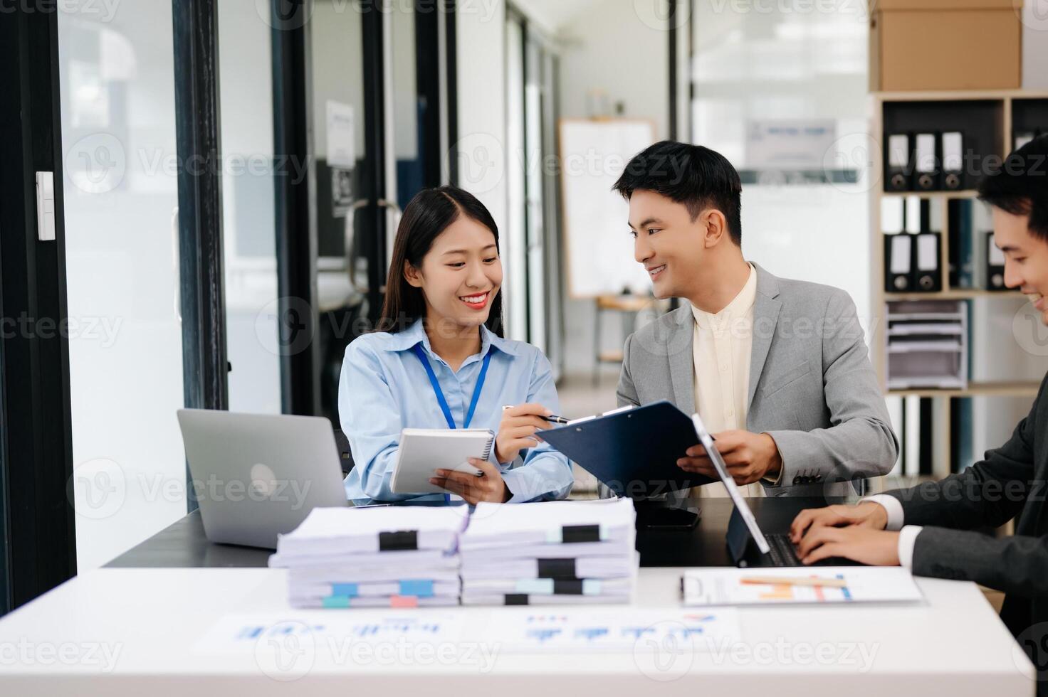 Business team discuss at meeting room. working together with laptop ,tablet and smart phone on desk Financial accountant , planner , meeting , introduction concept. At office photo