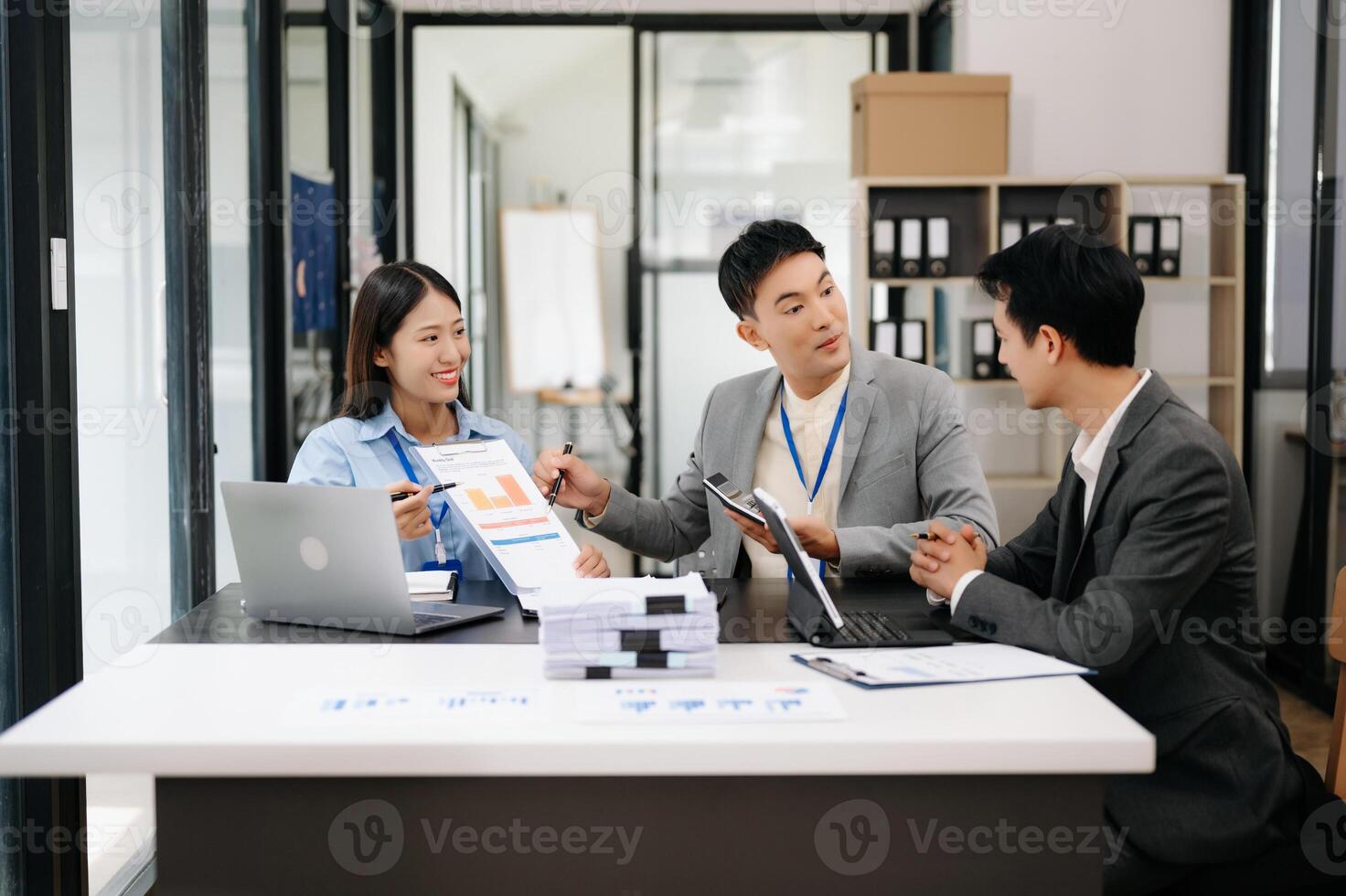 Business team discuss at meeting room. working together with laptop ,tablet and smart phone on desk Financial accountant , planner , meeting , introduction concept. At office photo