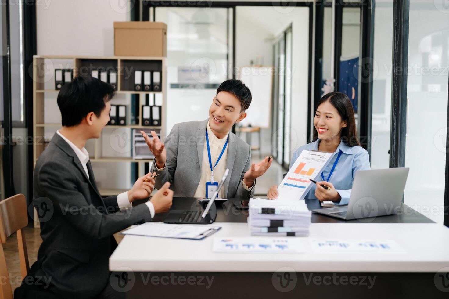 Business team discuss at meeting room. working together with laptop ,tablet and smart phone on desk Financial accountant , planner , meeting , introduction concept. At office photo