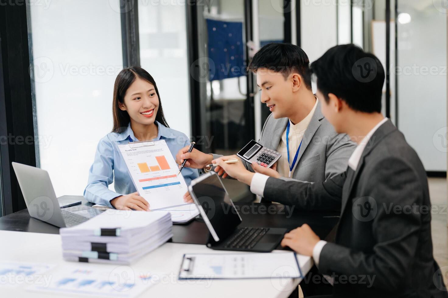 Business team discuss at meeting room. working together with laptop ,tablet and smart phone on desk Financial accountant , planner , meeting , introduction concept. At office photo