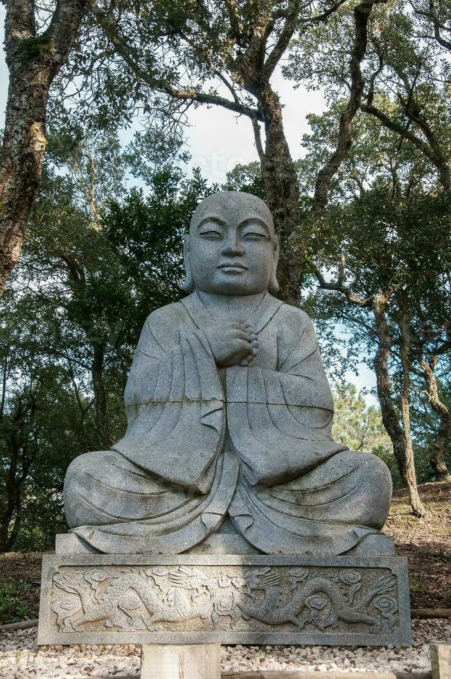 Statue in Budha Eden Park, in Portugal photo